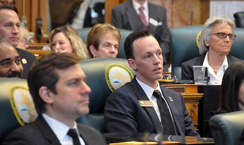Rep. Dylan Roberts listens to remarks by House Speaker Crisanta Duran on the opening day of the 2018 Colorado legislative session.