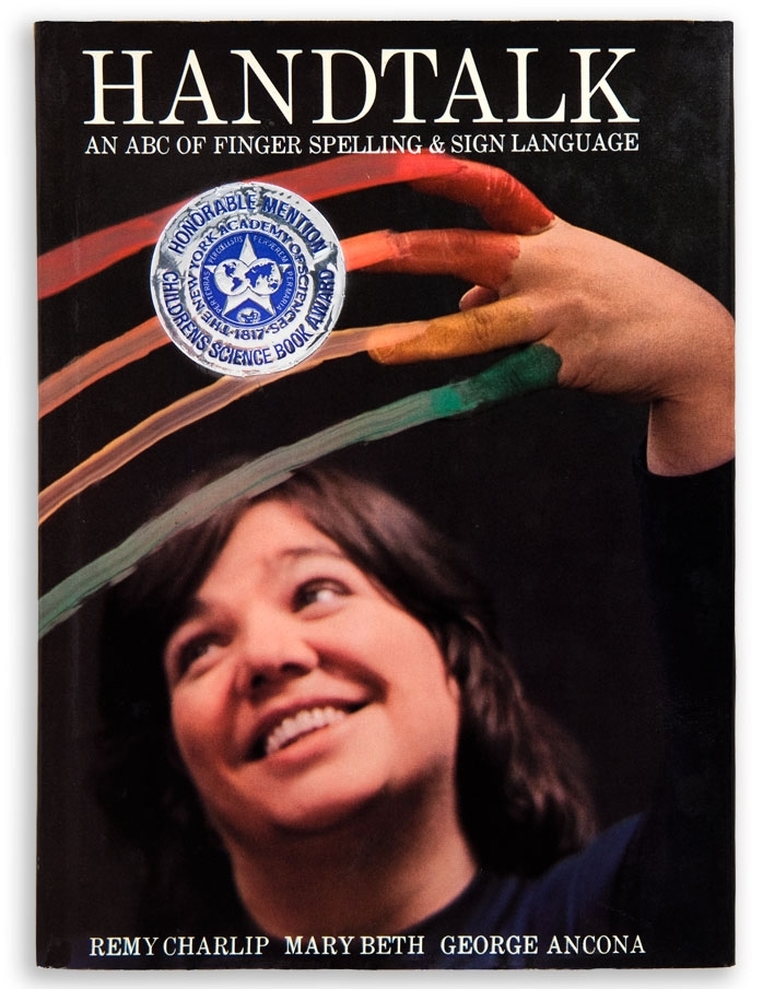 HANDTALK: AN ABC OF FINGERSPELLING AND SIGN LANGUAGE. Text by Remy Charlip and Mary Beth. Photographs by George Ancona. Parents Magazine Press, 1974