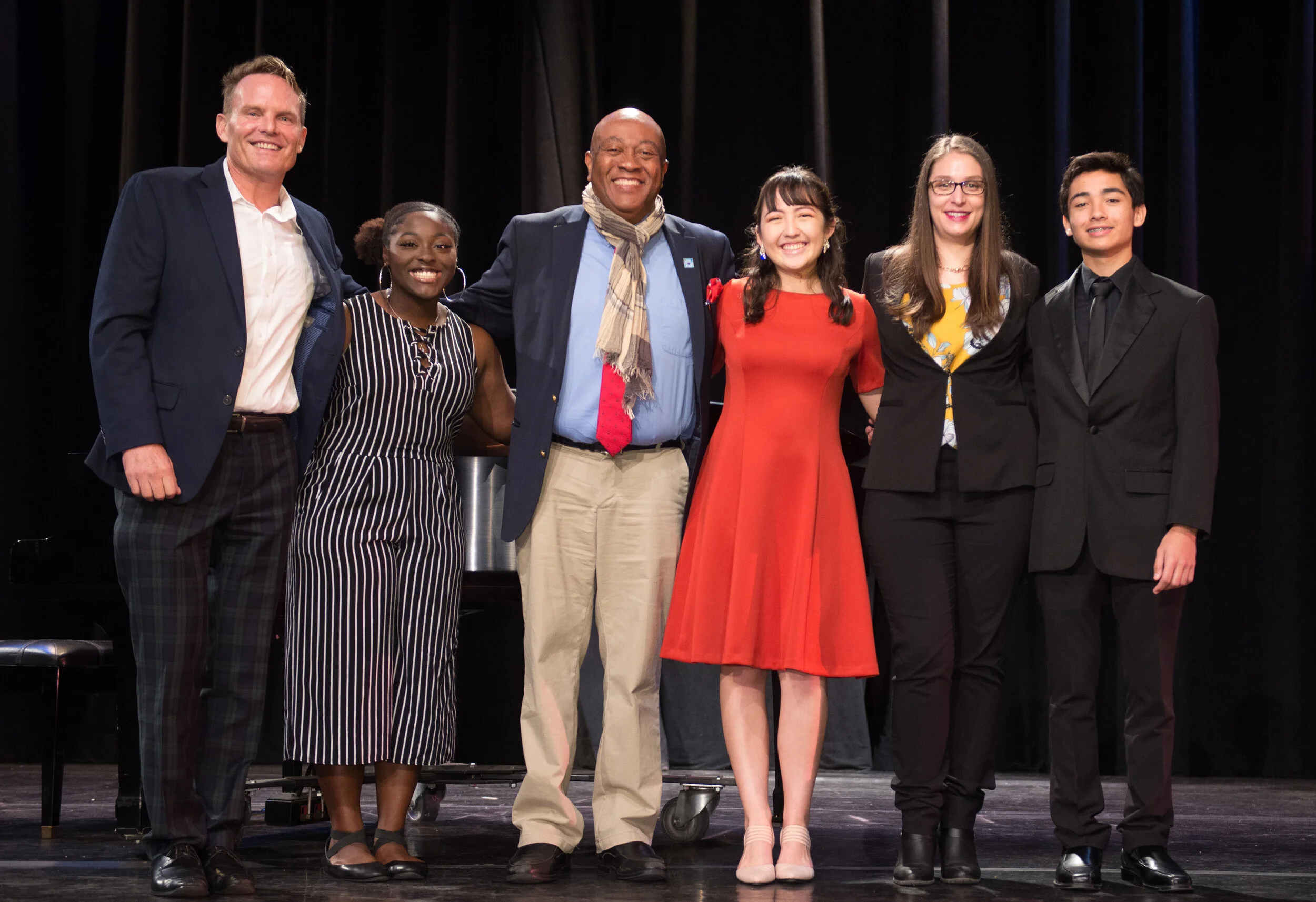 2019 Junior ATC singers at the Finals concert with Judges David Pratt (Executive Director, Austin Symphony), Roger Moss (Co-Founder, Savannah Children’s Choir), and Dr. Briana Sosenheimer (Lecturer Voice/Opera, Georgia Southern University).  Photo by