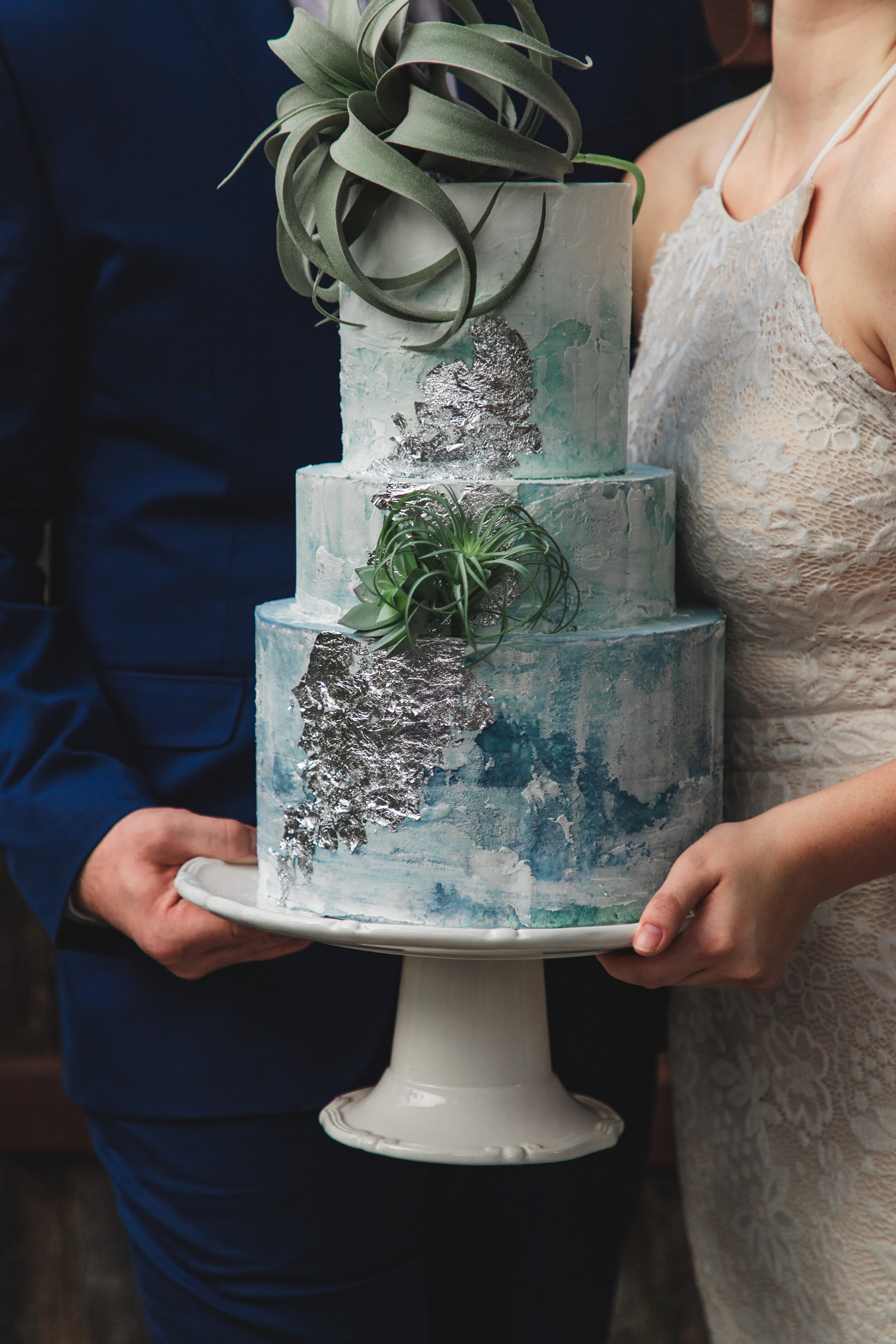 Couple holding cake