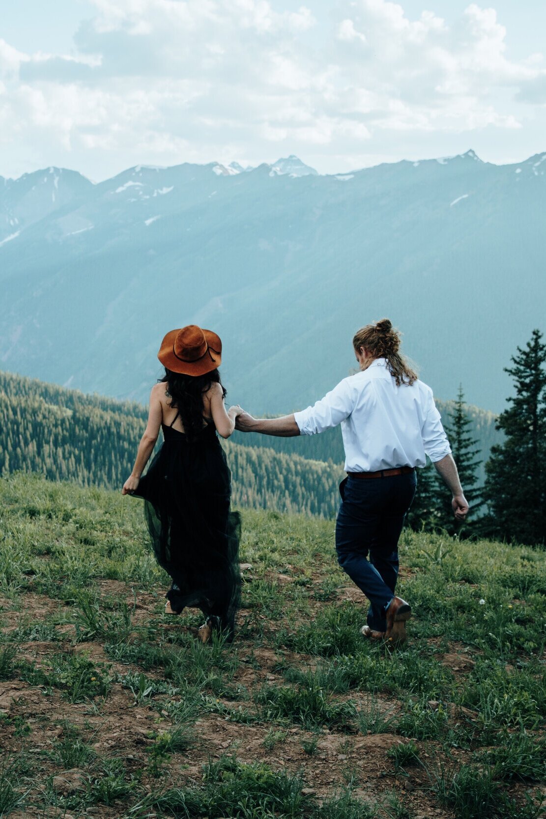 A couple walking in the mountains of Colorado.