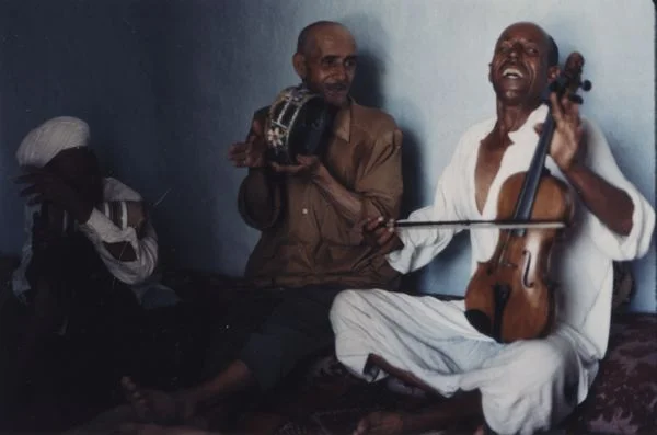 Mohammed "Berdouz" Attar Sr. (far right) playing kamanja