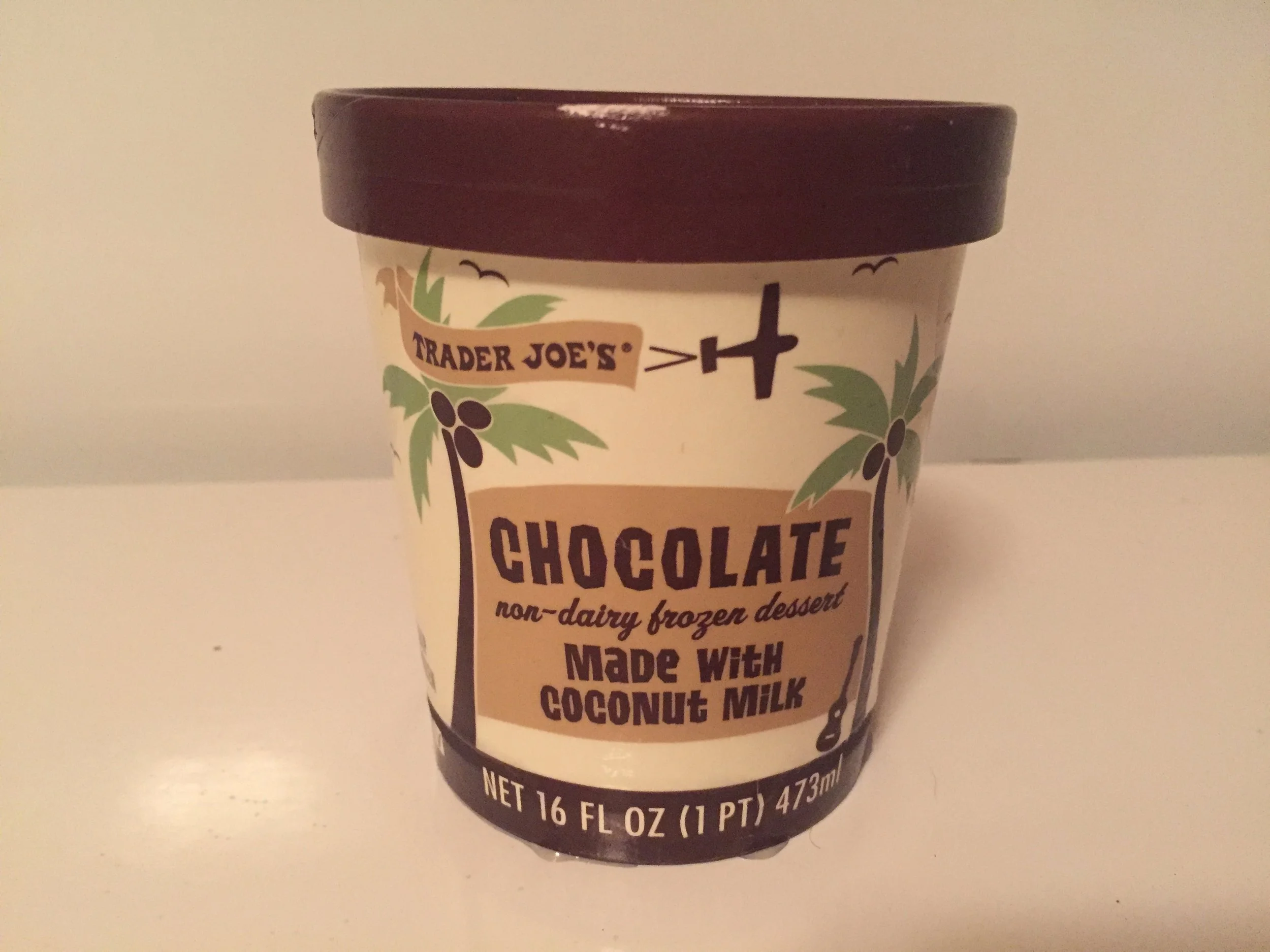 Trader Joe's Non-Dairy Frozen Dessert made with coconut milk in Chocolate : The texture of this dessert is definitely thicker and creamier than the NadaMoo! but not quite as thick as the Ben & Jerry's. The flavor of the coconut milk comes through quite strong, and I was not as turned off by it as I expected. It's definitely a treat I would have to be in the mood for though. Each serving has 180 calories. 