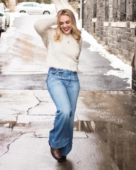 bell bottoms white sweater about to kick.jpg
