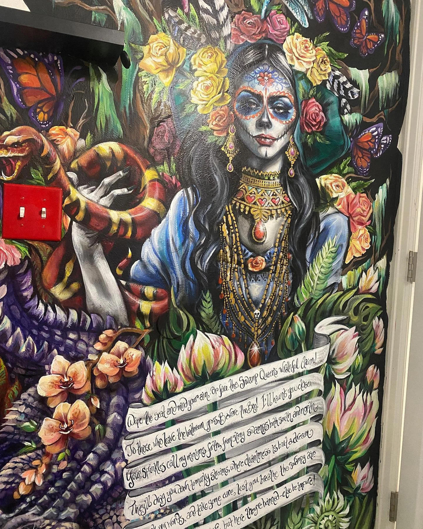 You remind me of a woman
What woman 
The woman with the power
What power
The power of voodoo 
Who do 
Oh you do, you do. 
You what?
Rinse and repeat as necessary. 
(Our girl is intended to be a cross between La Catrina and a voodoo witch doctor. She 