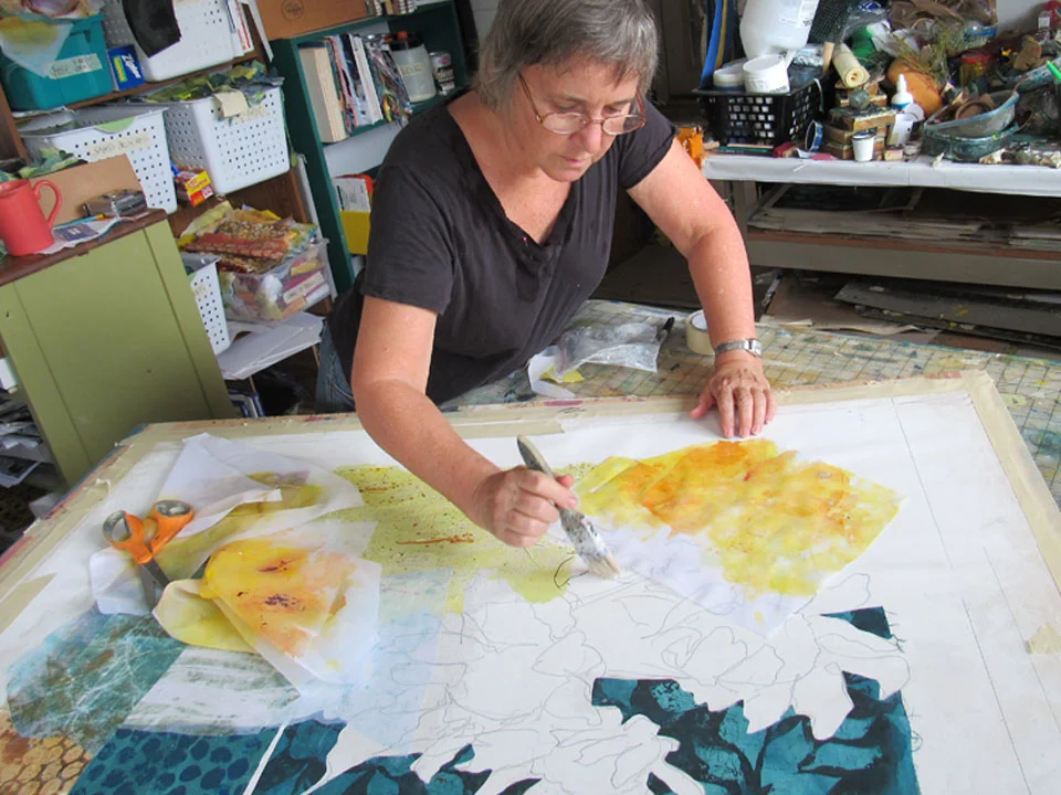 I created pieces of transparent fabric in vibrant yellows and oranges to collage into the flowers. Printed loosely, wet-into-wet. I did not cut the fabrics to fit my sketch tightly. I wanted a freer construction for this work.