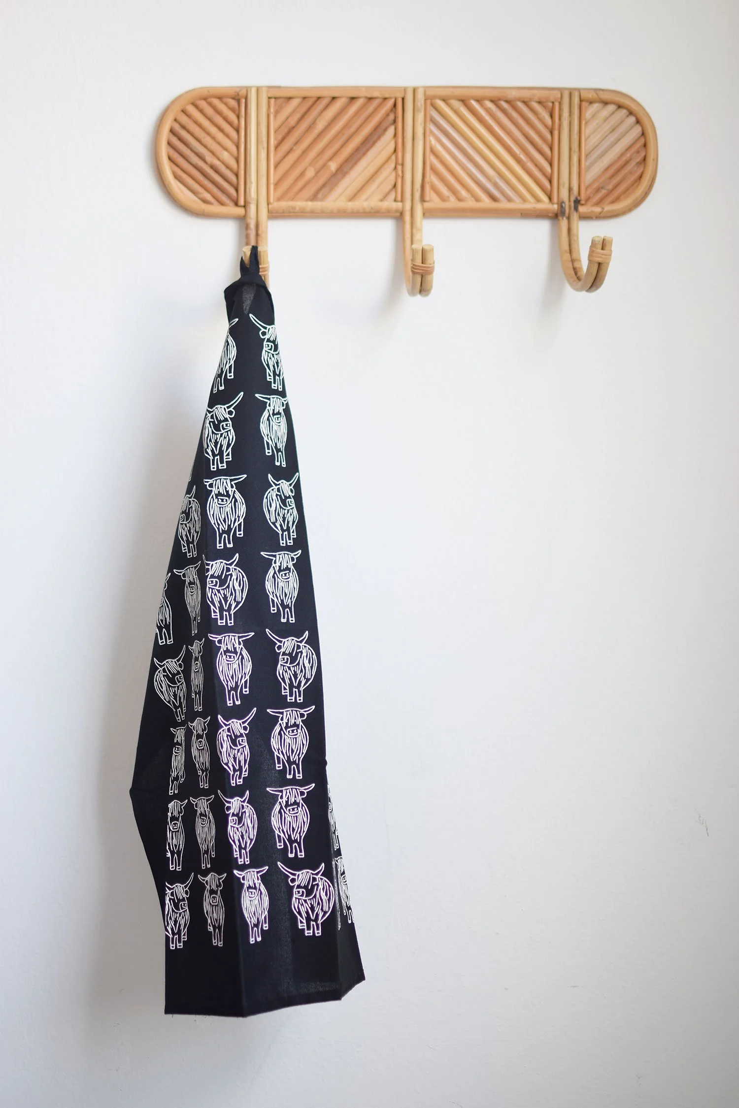 Black and white highland cows organic cotton tea towel by local edinburgh artist Sally Fisher