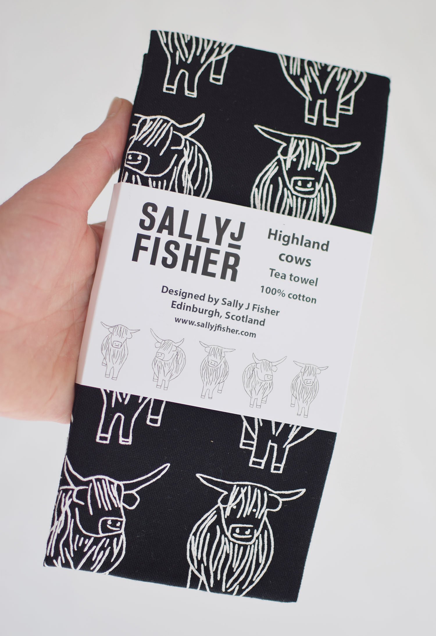 Black and white highland cows organic cotton tea towel by local edinburgh artist Sally Fisher