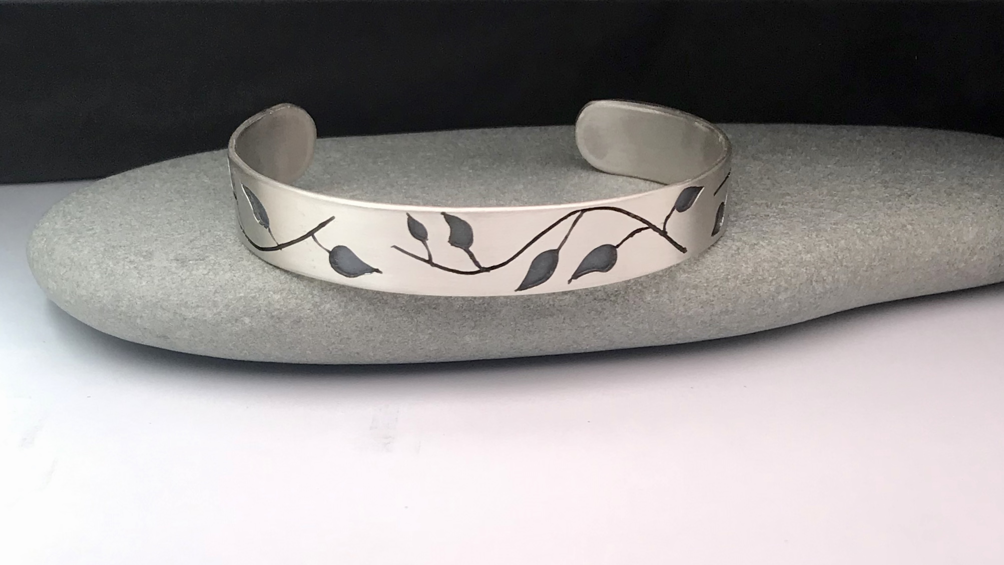Cuff Bracelet Depicting Leaves in the Wind