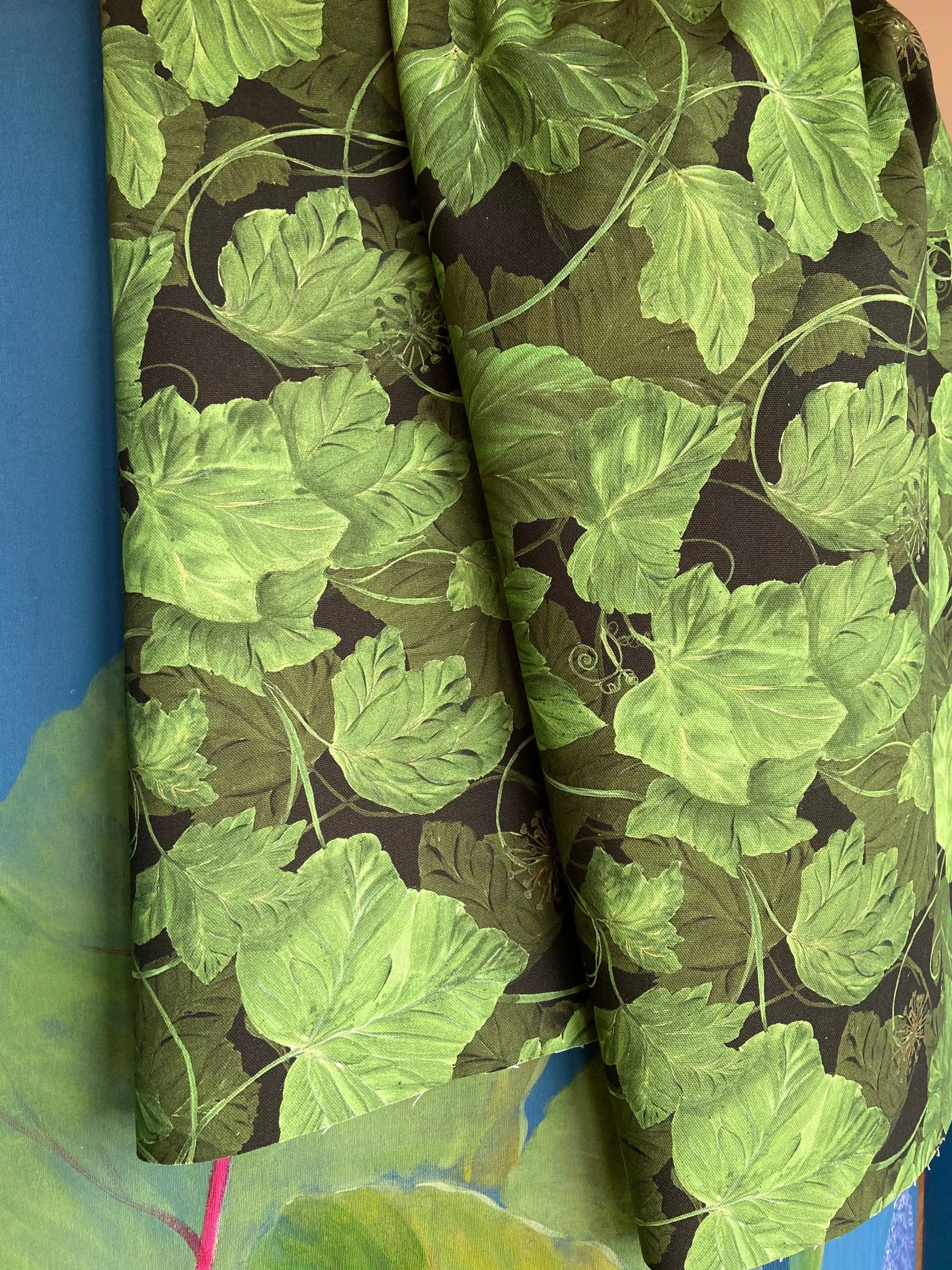 Hand painted ivy design printed onto natural ecological furnishing fabric.  A bold botanical design on a black background, good for restaurants, hotels, kitchens and soft furnishings.