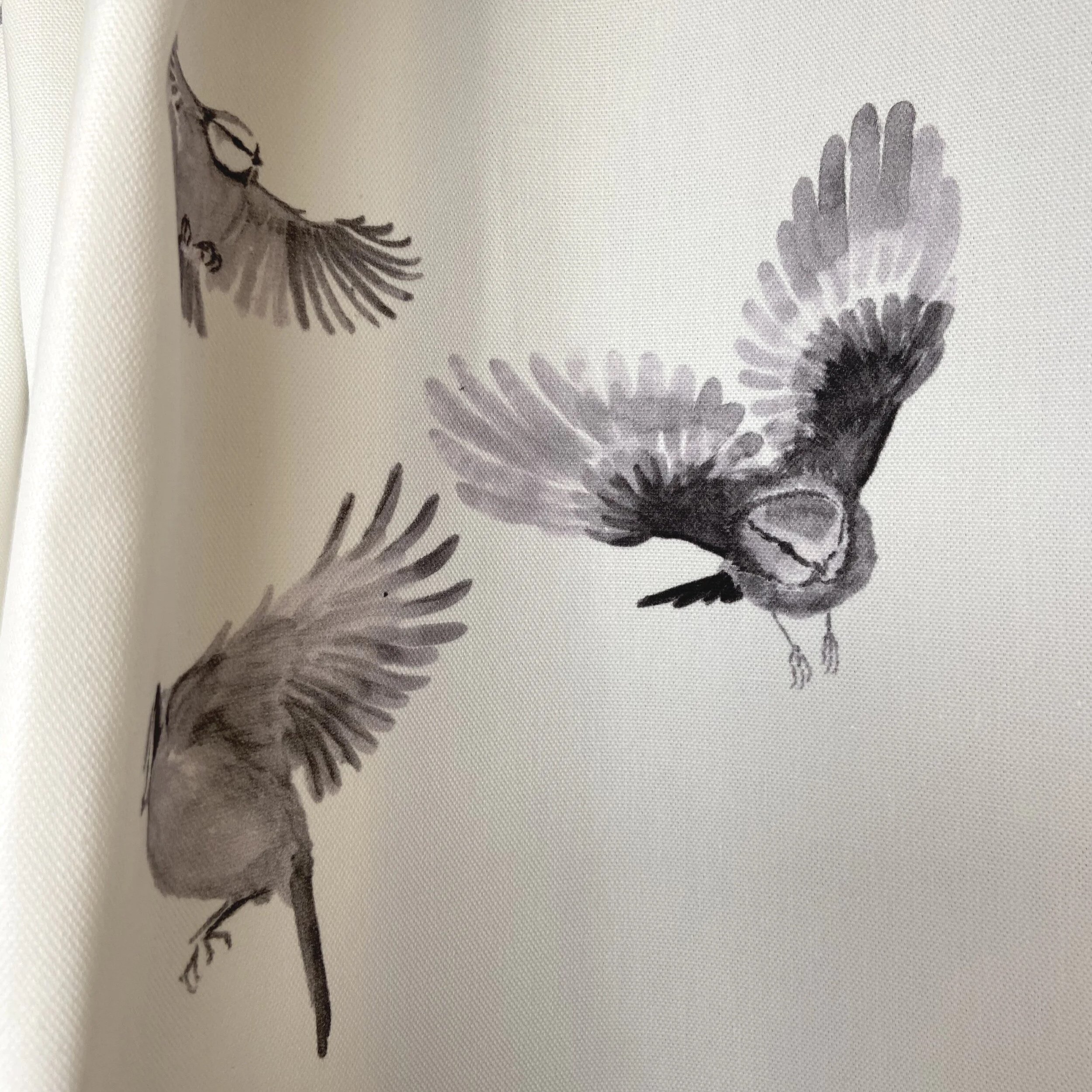 Hand painted British birds printed onto white furnshing fabric, painted in Hampshire and printed in Britain