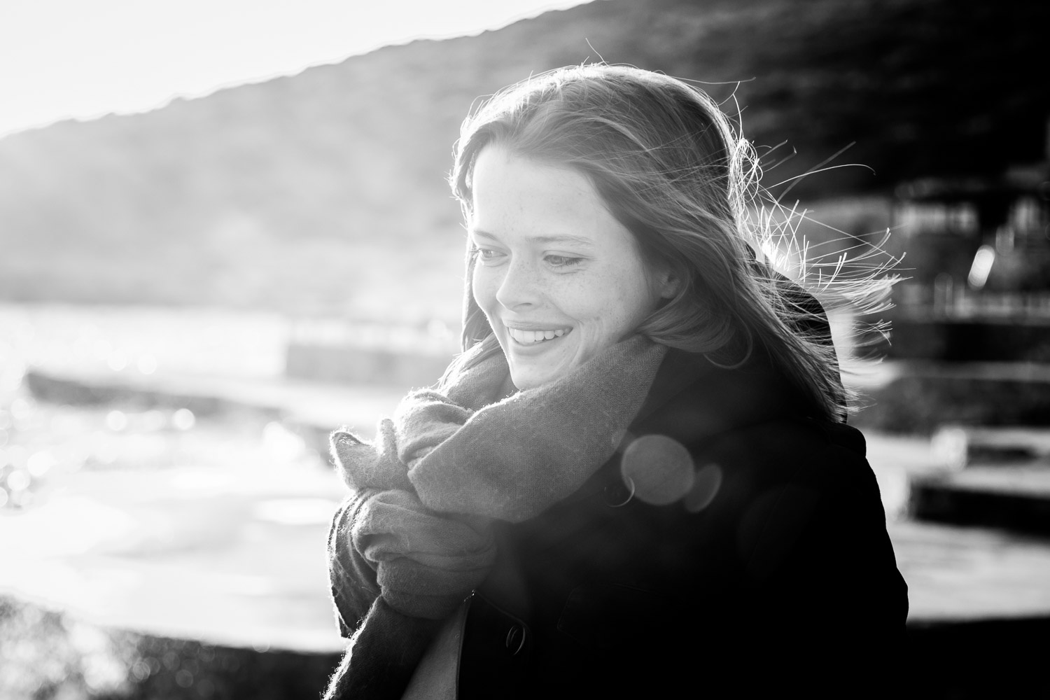 Black&White-Outdoor-Winter-Backlit-Natural-Light-Portrait-Young-Smilling-French-Woman.jpg