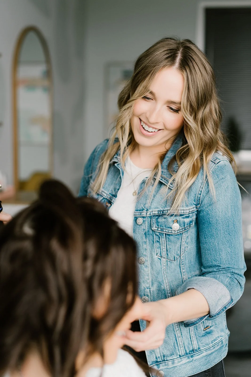 Teddi styling a client’s hair in her private Carmel, Indiana hair studio.