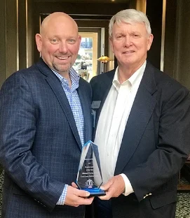 Pictured: Michael Purvis, CEO of Cook Medical Center with Jimmy Lewis, CEO of Hometown Health.