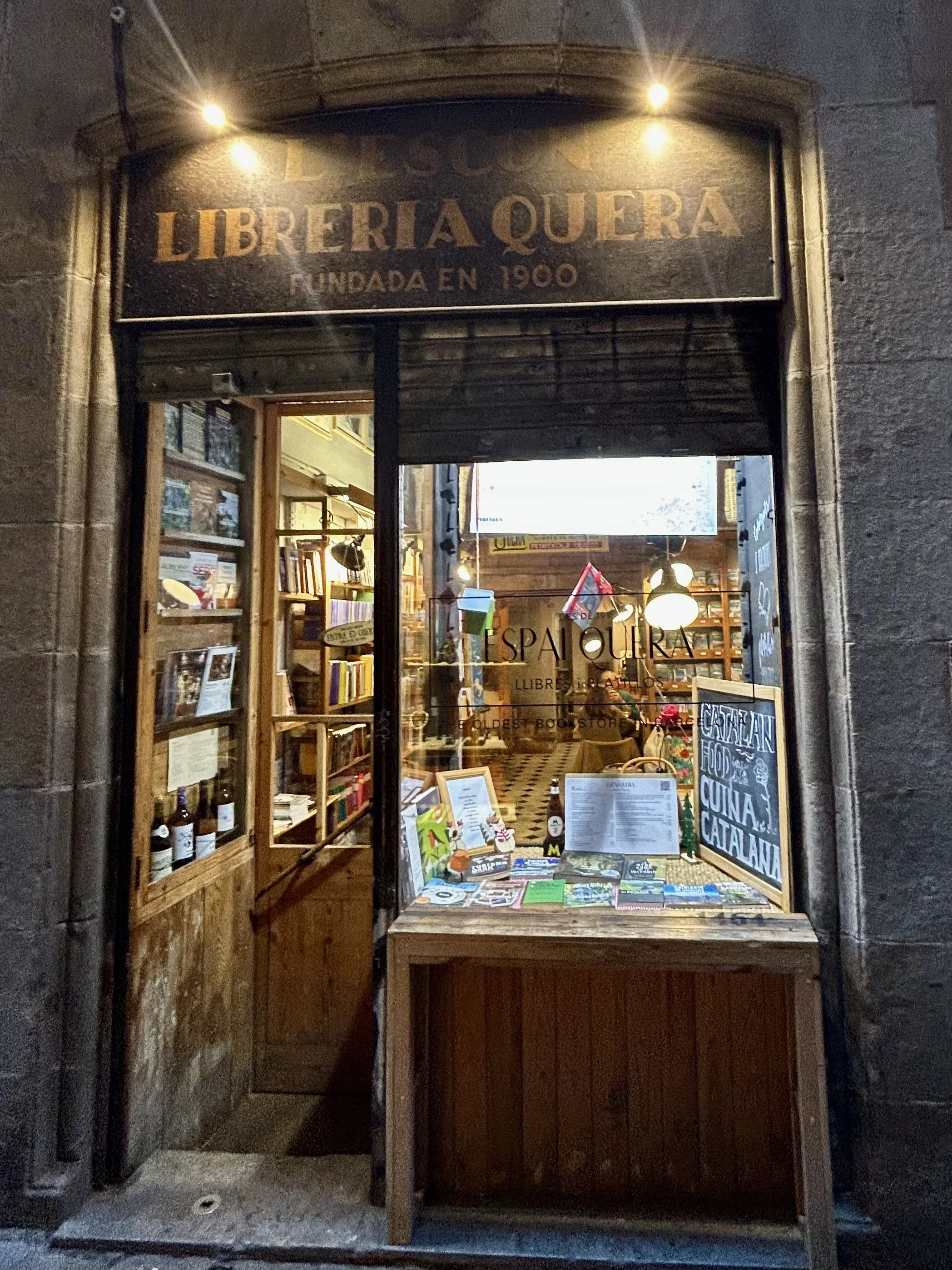 Exterior of Libreia Quera, a historic bookshop serving wine and food