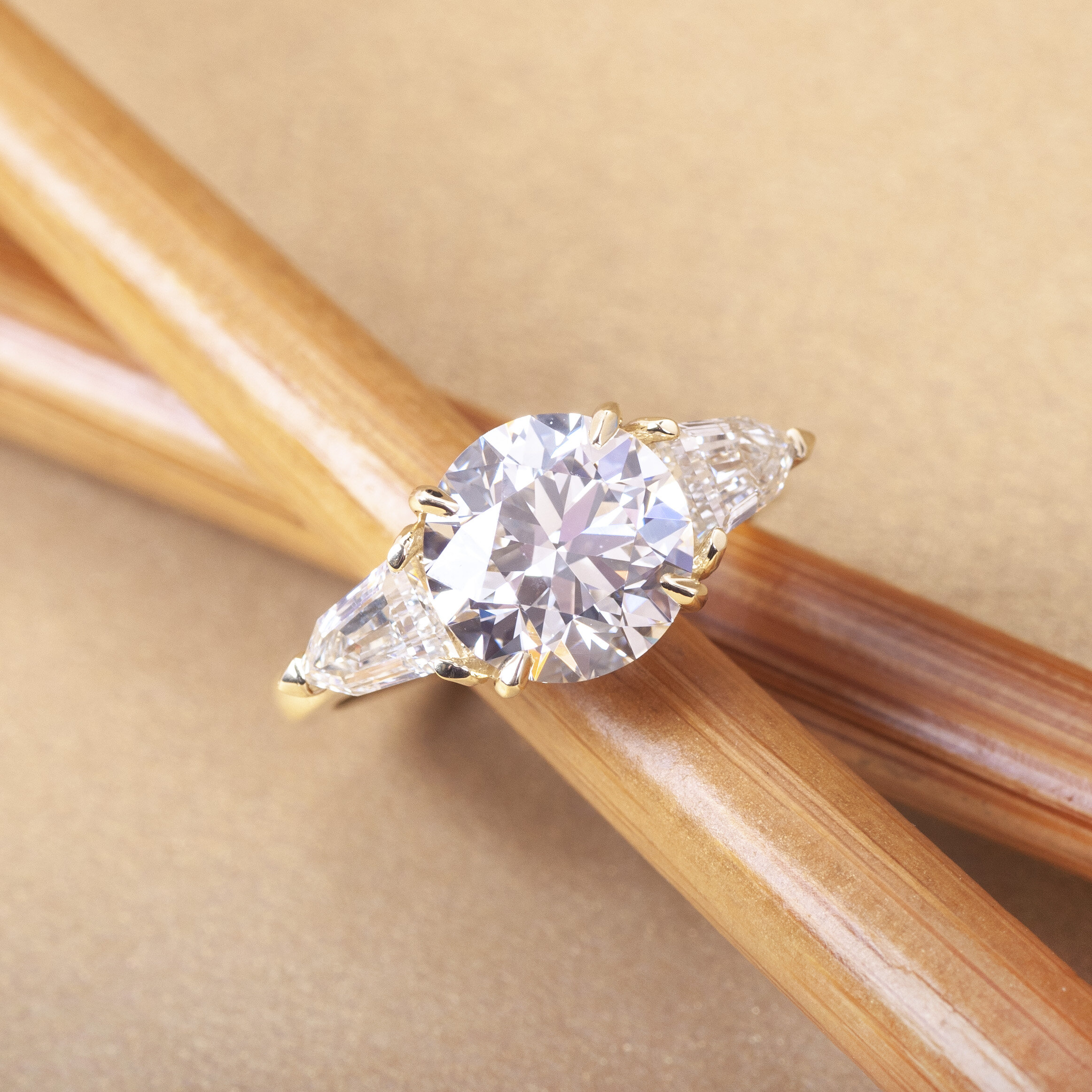 three stone engagement ring on chopsticks editorial.jpg