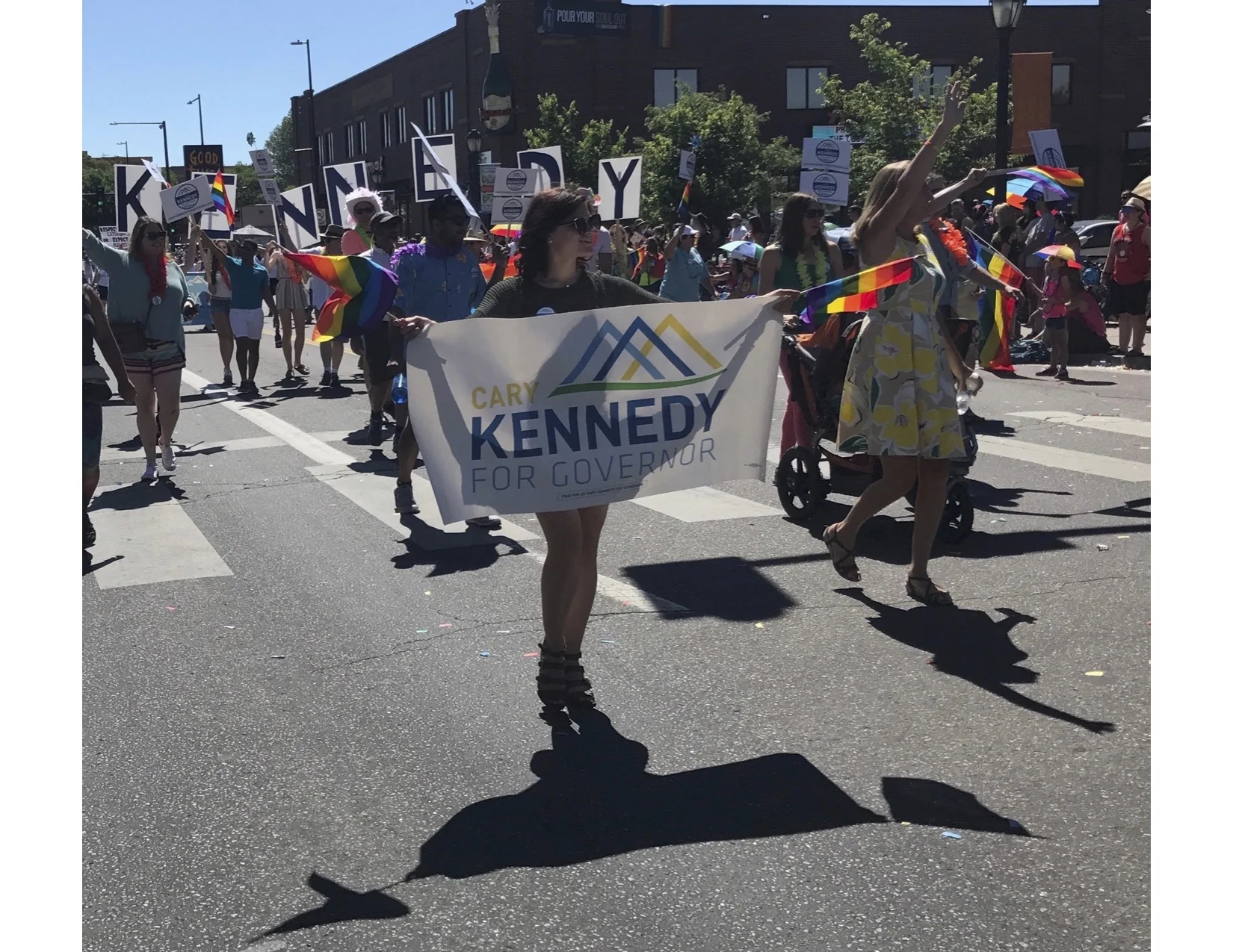 Jordan marching with Cary in the Denver Pride Parade, Summer 2017