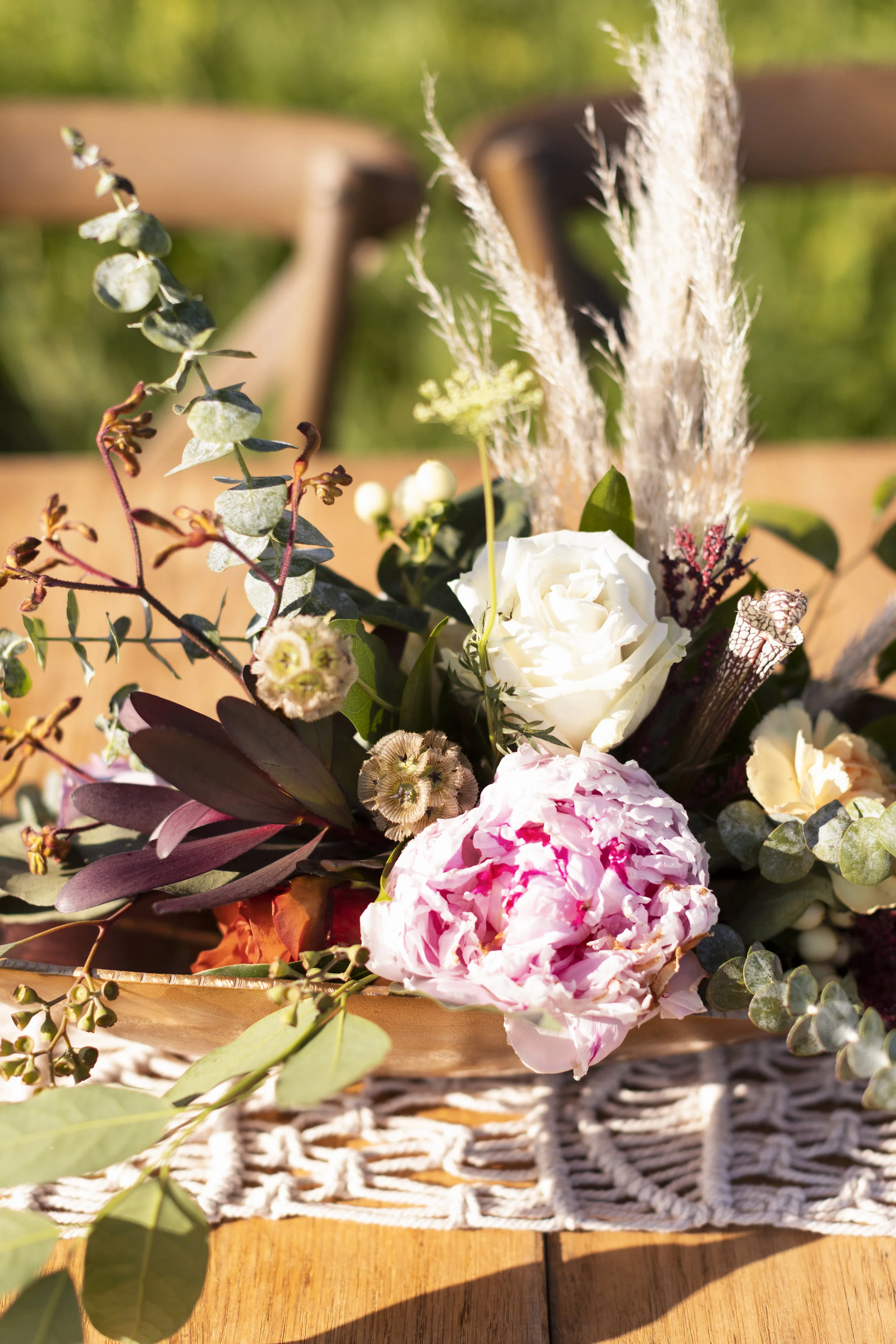 Flowers & Arch: @thistles_pella Photography: @heatherferreria Hair: @alstreet.rmh Make-up: @lc.henderson Calligraphy: @lydiabandstra Table, Rug, Chairs: @pellarental Macrame: @kristajo60