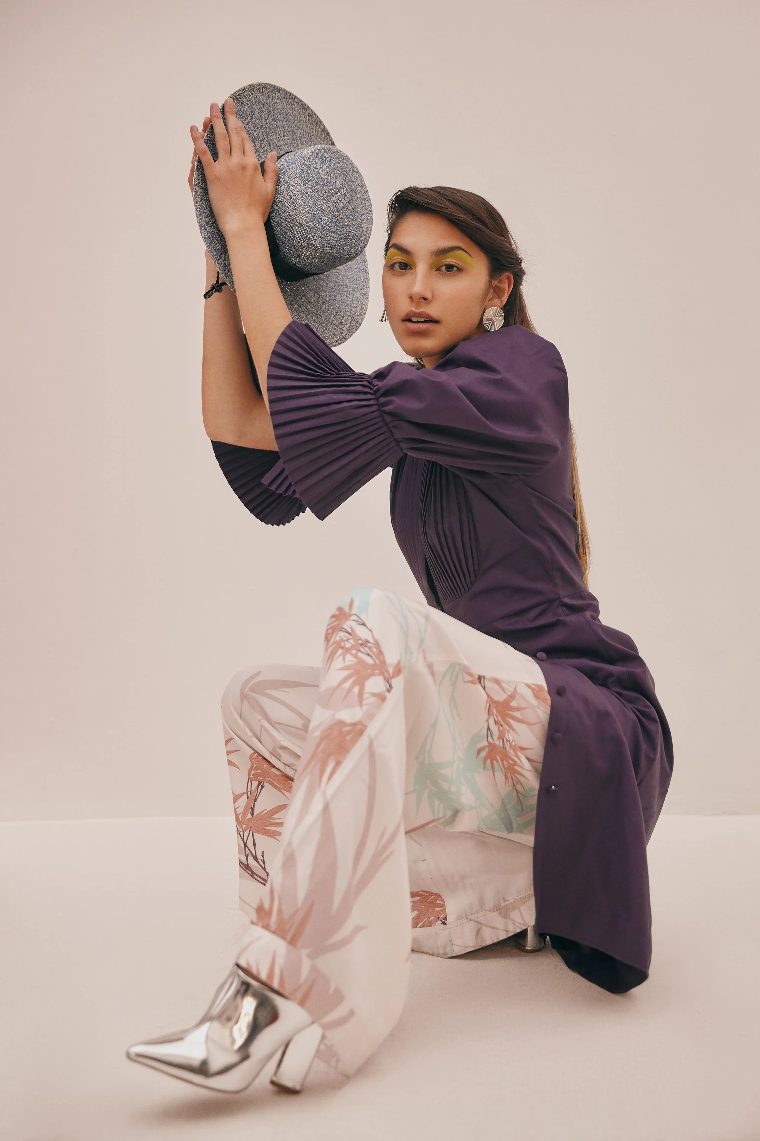 Dress: Carlo Carrizosa - Pants: Pink Filosofy - Hat: Lina Osorio - Jewelry: Aysha Bilgrami - Boots: Stylist's own.