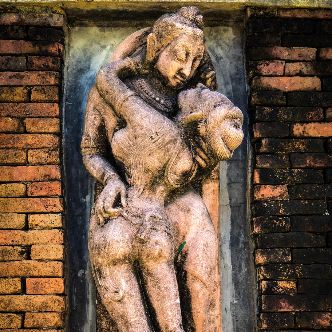 Tantra statues intertwined in a loving embrace.