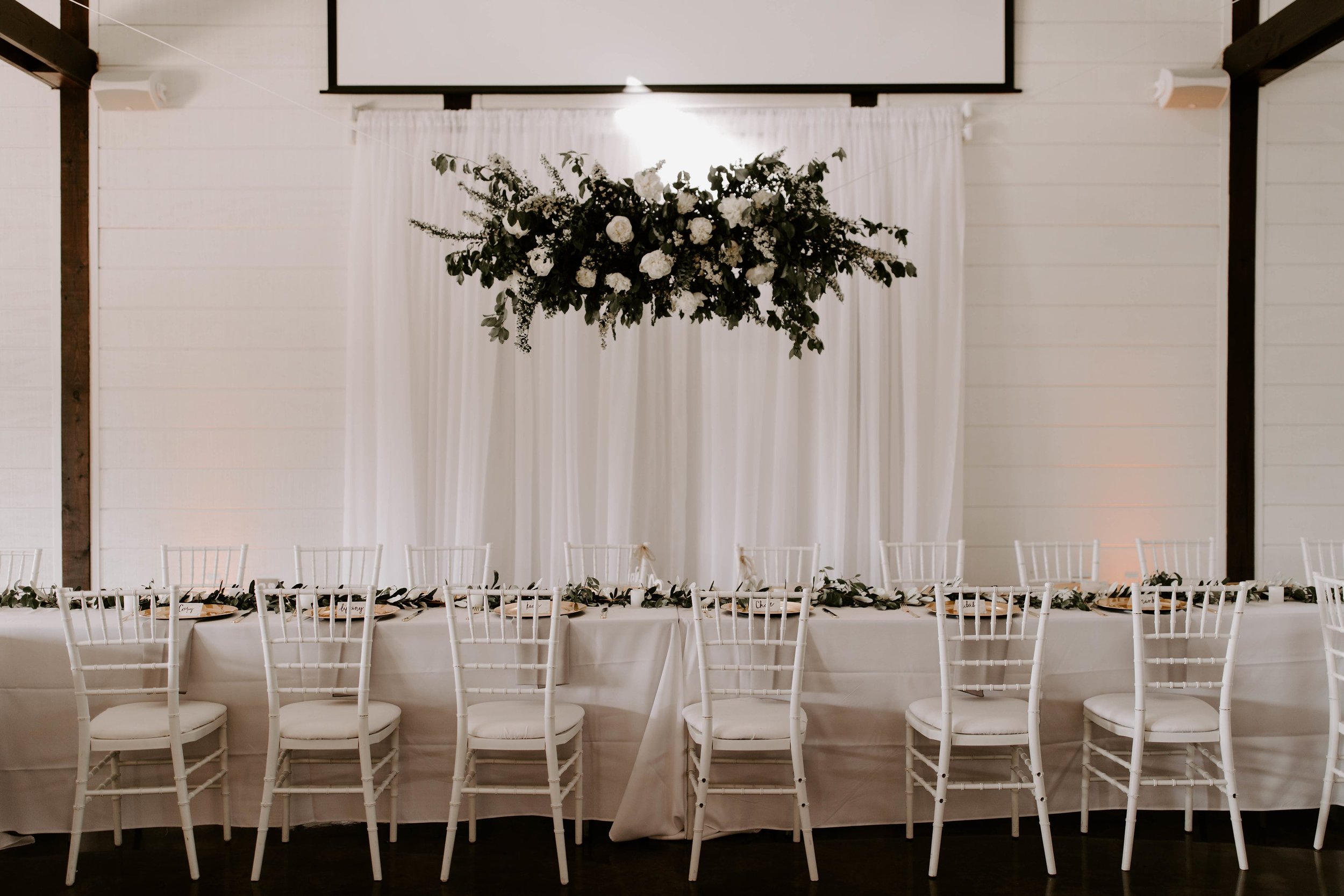 floral installation tulsa wedding venue head table-min.jpg