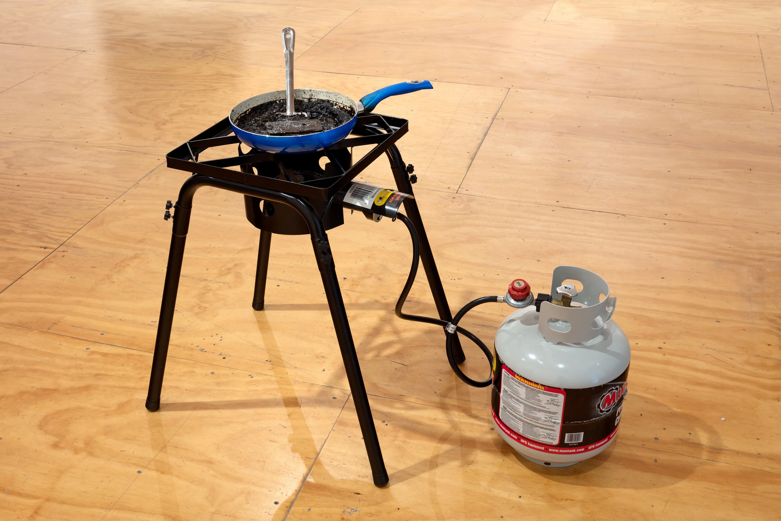 Untitled (Portal), 2018 Outdoor burner, propane tank, skillet, Coca-Cola, smartphone, spatula (47 Canal, NY)