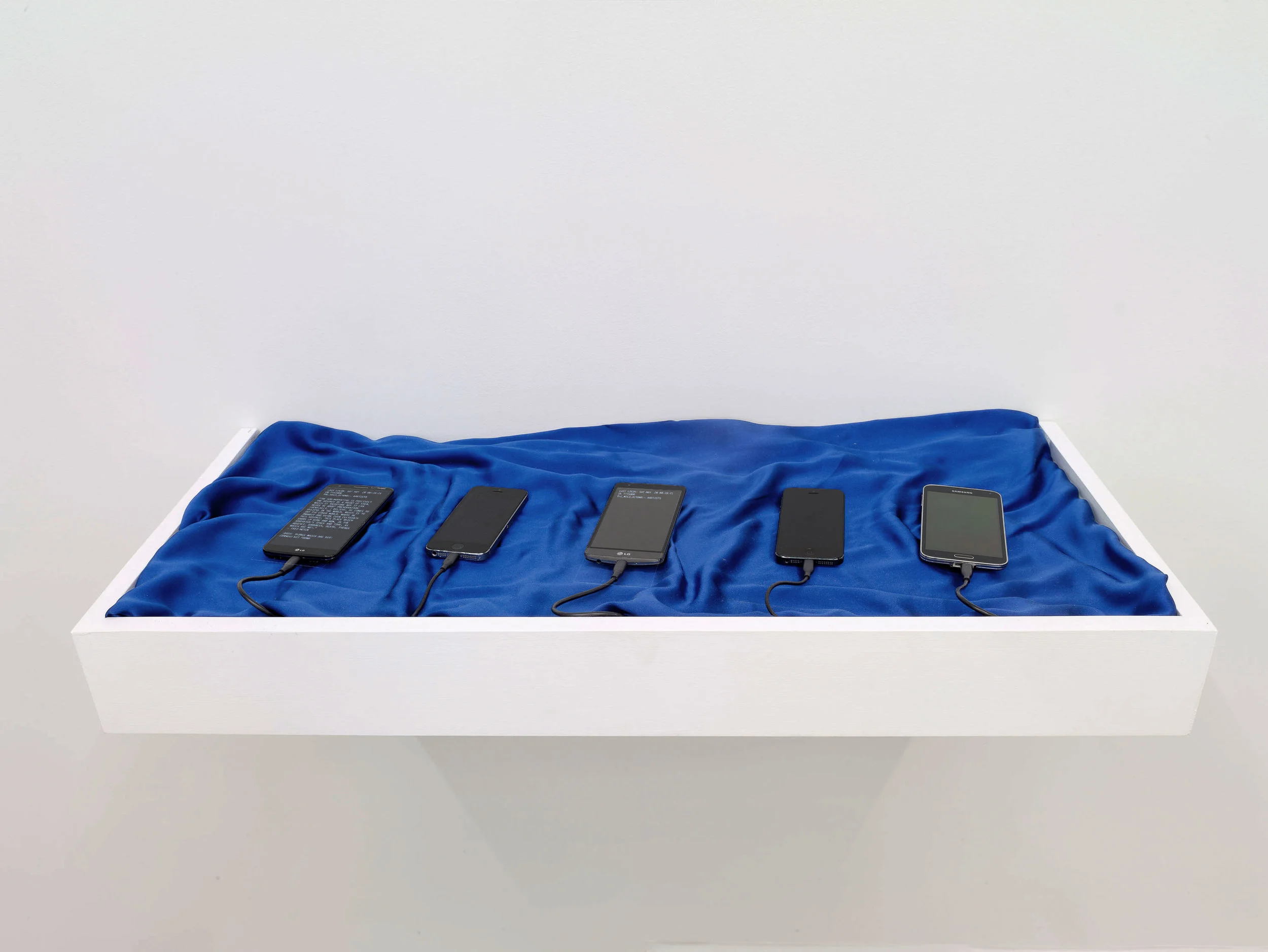 Towards the Wild Beyond, 2017 Various smart phones, command-line interface, blue silk cloth, wood (Koenig & Clinton, Brooklyn, NY), Photo: Jeffrey Sturges