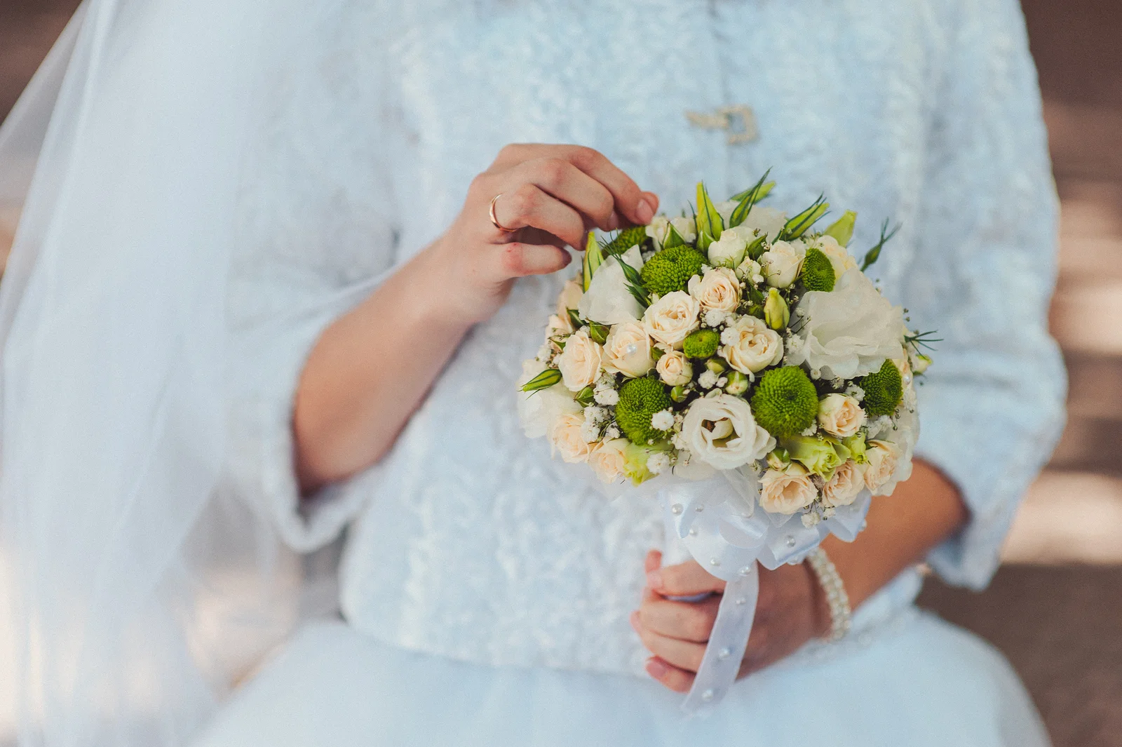bigstock-Bride-Holding-Big-Wedding-Bouq-195104521.jpg