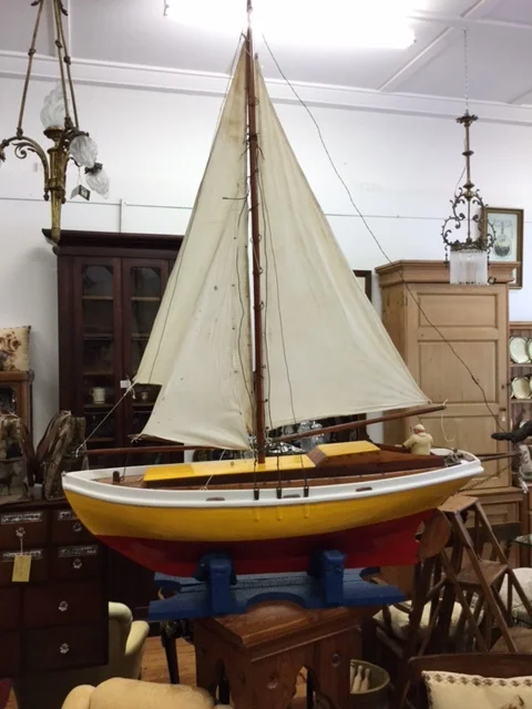   Sailboat   Period:&nbsp;1910  Description: Yellow sailboat with mesh sail.&nbsp;    