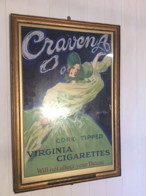 Framed cigarette advertising poster