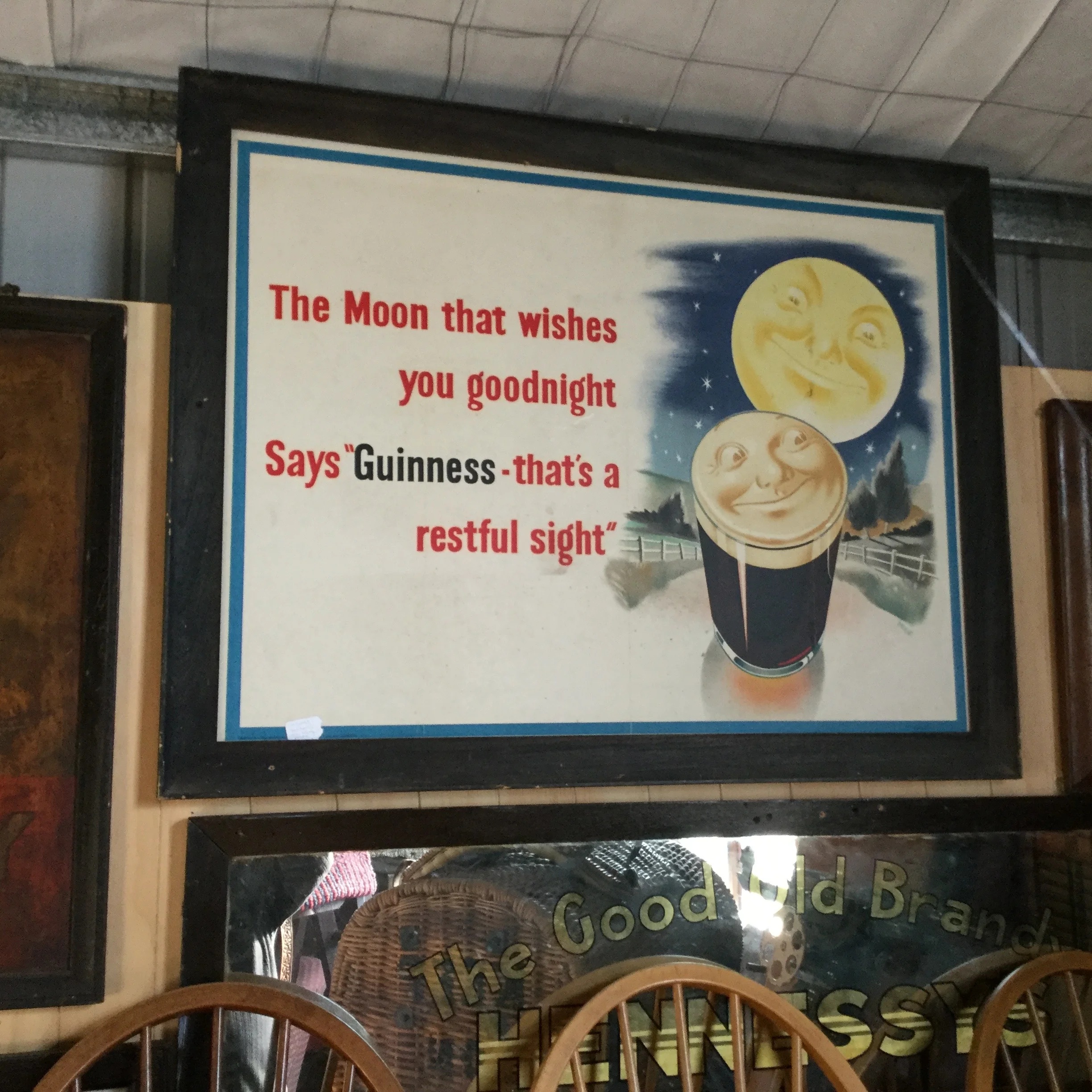 Guinness advertising poster behind glass