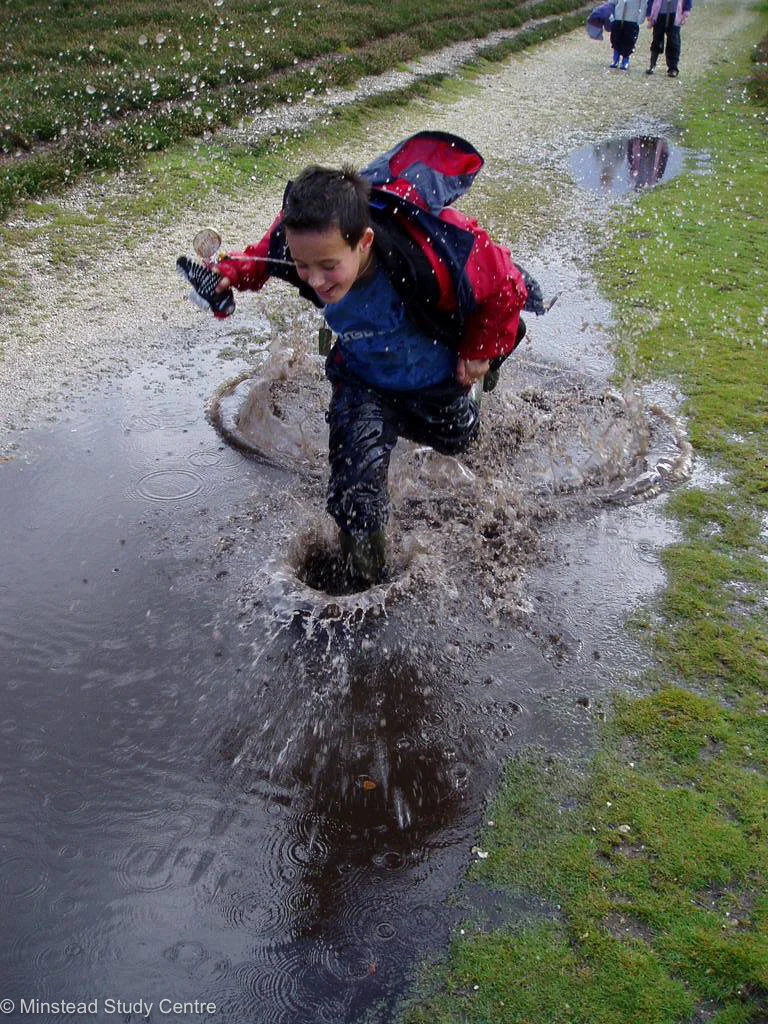 Running through puddles at Minstead Study Centre
