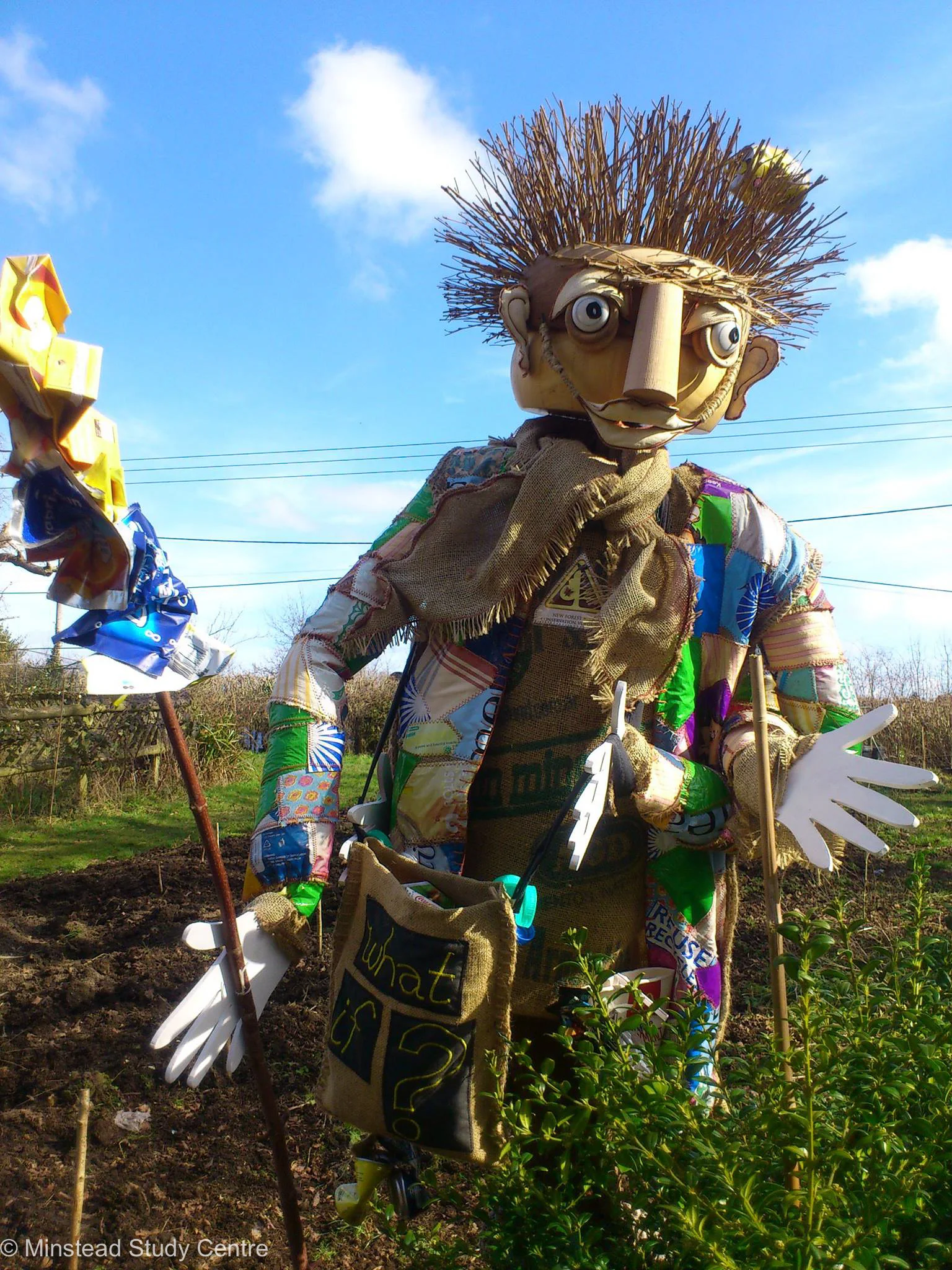 Scarecrow protecting the crop at Minstead Study Centre
