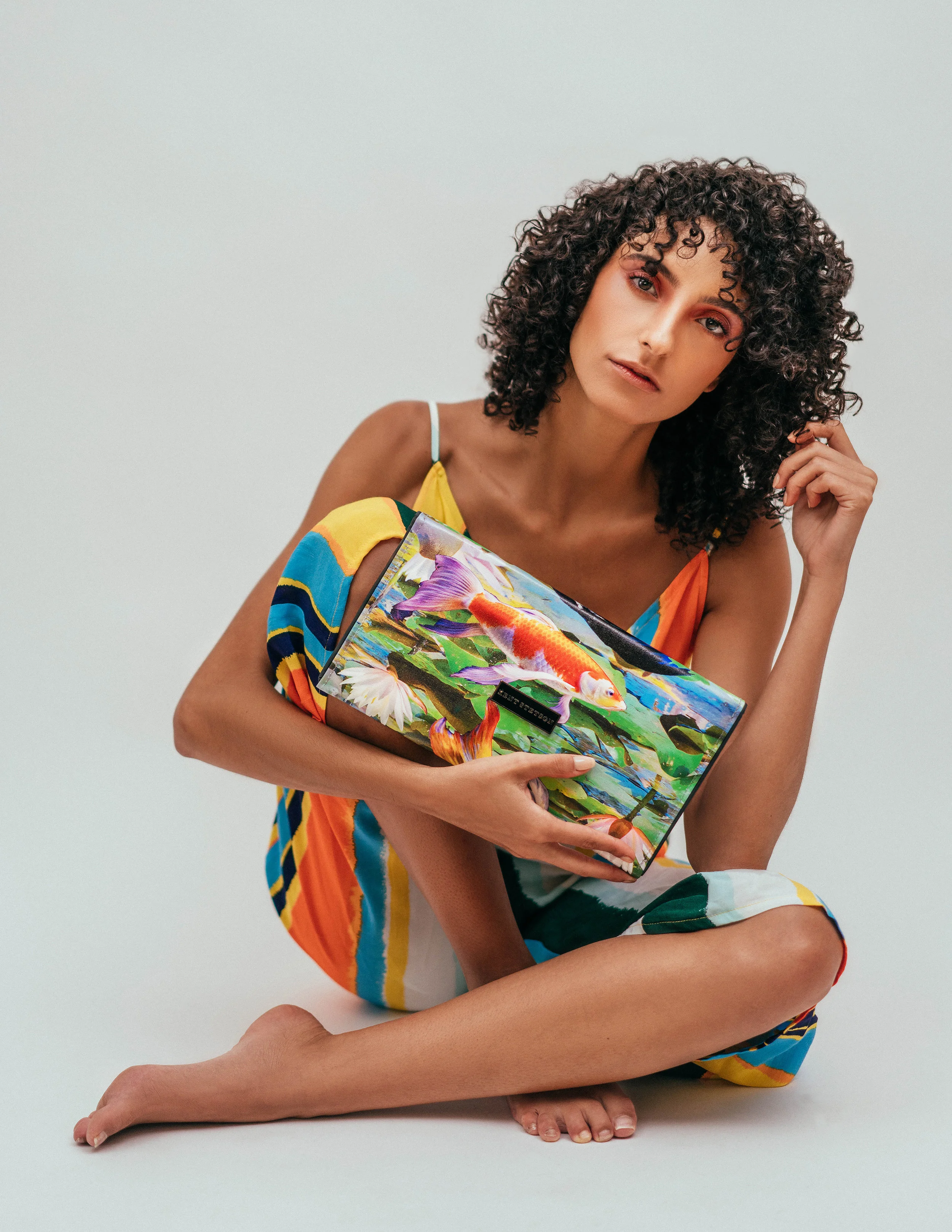 Jumpsuit: Topshop, Handbag: Kent Stetson