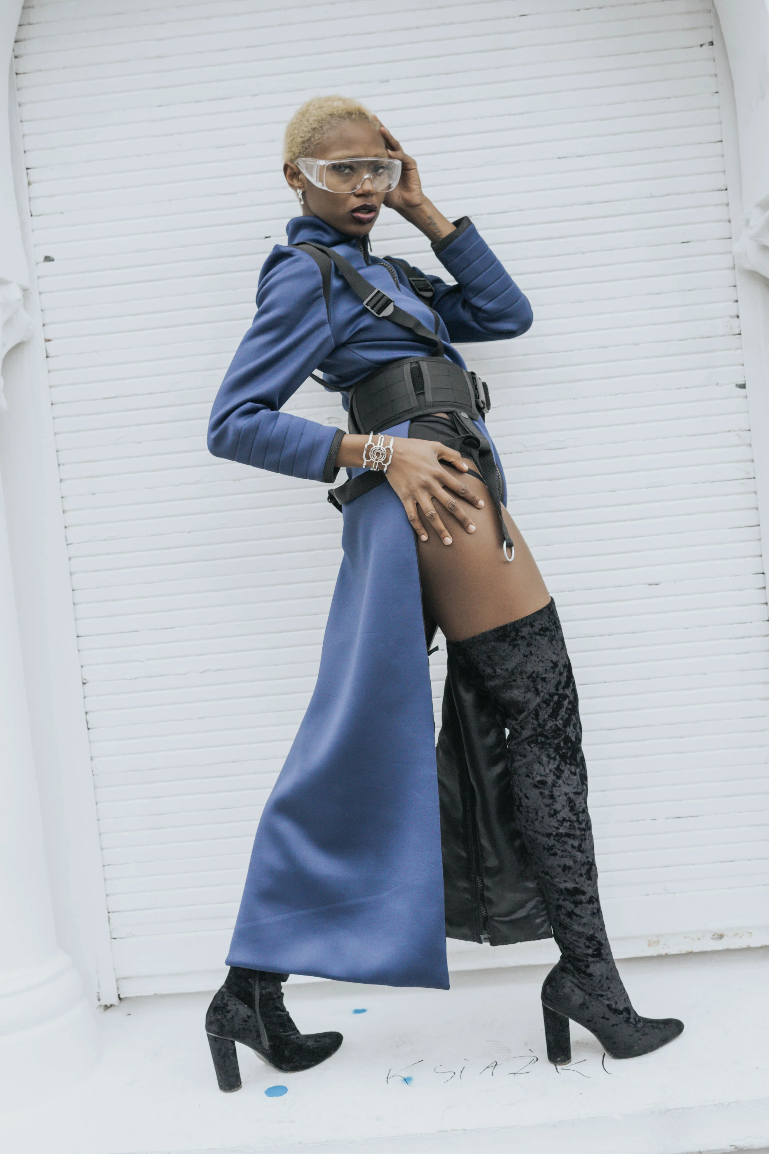 Photographer: Gaelle Andriantsarafara Female Model: Kiara Simmons Fashion Designer: Marine Arnoul Wardrobe Stylist: Stefnie K Photography Assistant: Lucie Monroe Wardrobe Credits: Blue neoprene dress-coat with black shiny neoprene yokes wi