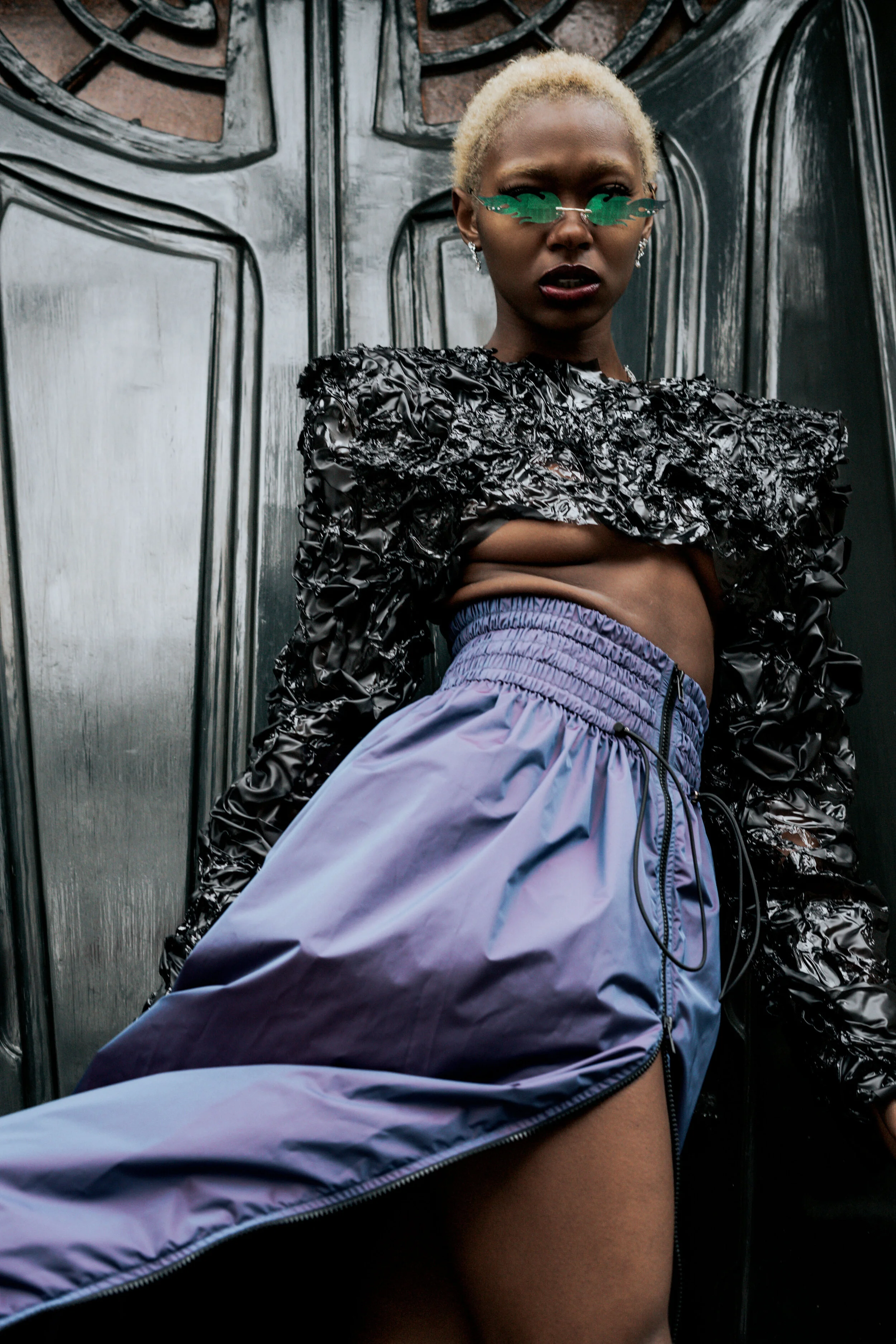 Photographer: Gaelle Andriantsarafara Female Model: Kiara Simmons Fashion Designer: Marine Arnoul Wardrobe Stylist: Stefnie K Photography Assistant: Lucie Monroe Wardrobe Credits: handmade top in upcycled heated PVC fabric , reflective purpl