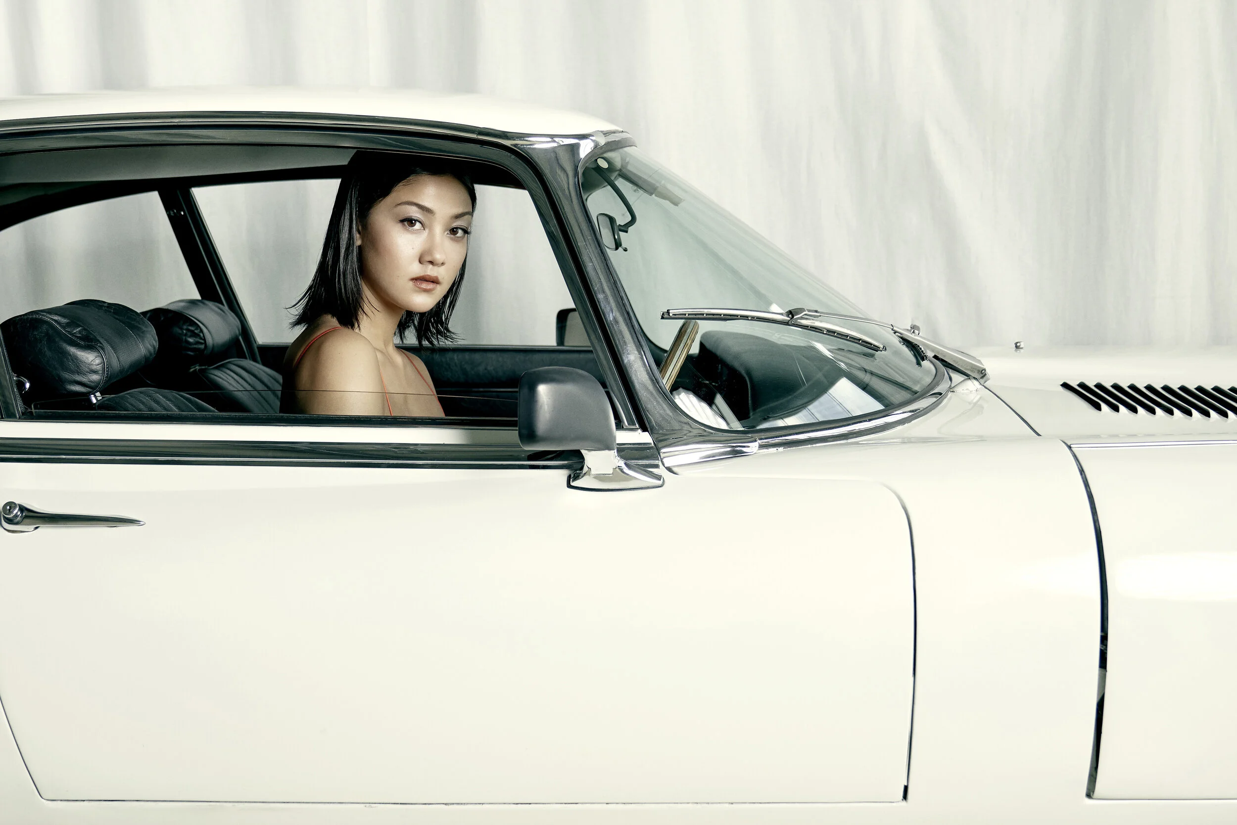 Photographer: Andrea Kadler Model: Muriel Dang @Promod Model Agency Makeup Artist: Ulla Kornelius Wardrobe Stylist: Andrea Light Assistant: Gertje Koenig Wardrobe Credits: Red Top by VIX Car JAGUAR E TYPE 12
