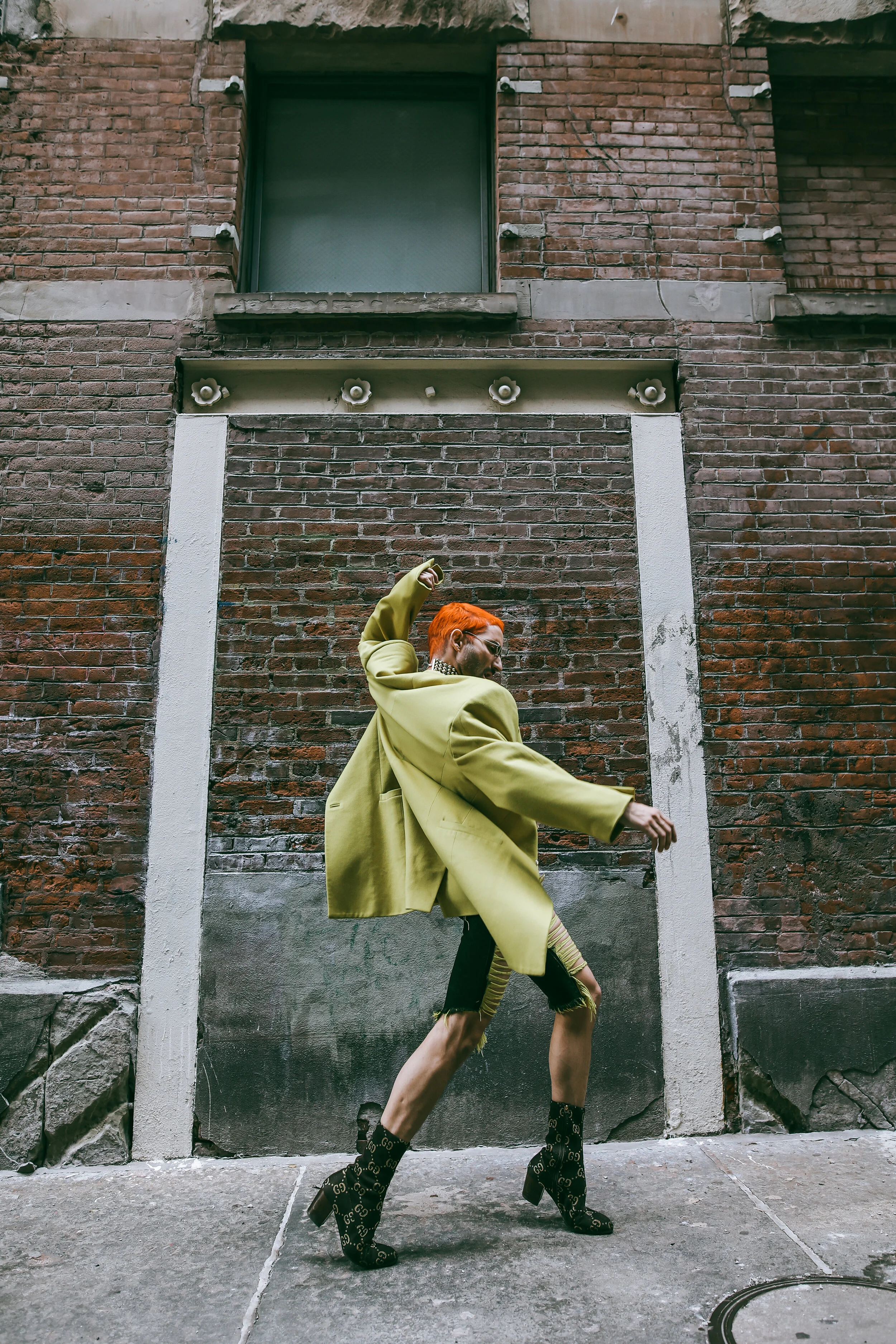 Photographer: Tatiana Katkova Wardrobe Stylist/Creative Director/Model/Makeup Artist/Hair Stylist: Andi Ospina Wardrobe Credits: Hair by: @michaelmorenohair Necklace by: @versace Jacket by: @versace Shorts by: @marques_almeida Boots