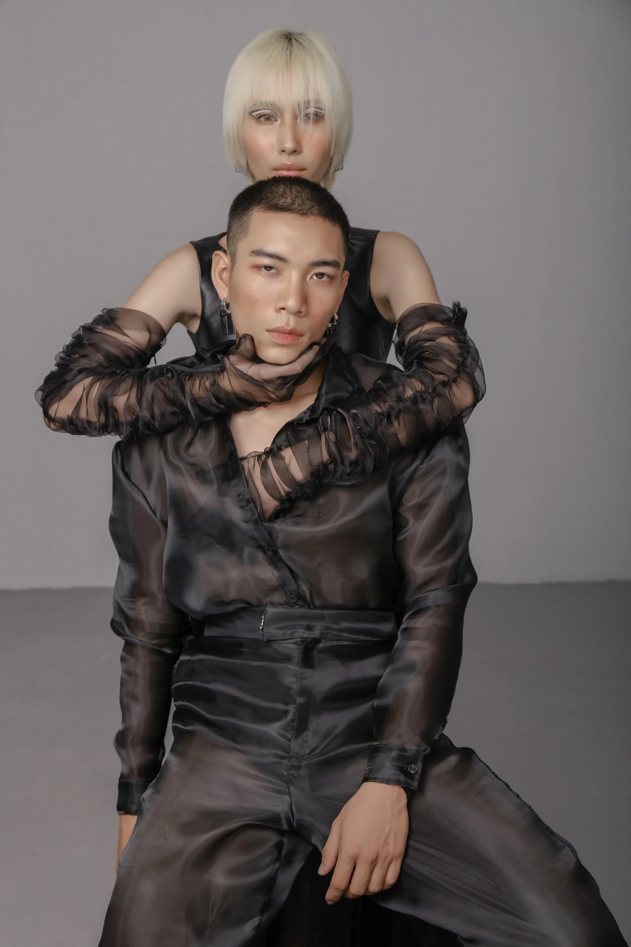 Photographer: Nguyen Du Creative Director: Kelbin Lei Female Model: Hang Nguyen Male Model: Hung Anh Makeup Artist: Xi Quan Le Creative Director: Kelbin Lei Wardrobe Credits: Hang Nguyen wears Top: Klei Studio Gloves: Kelbin Lei Acce