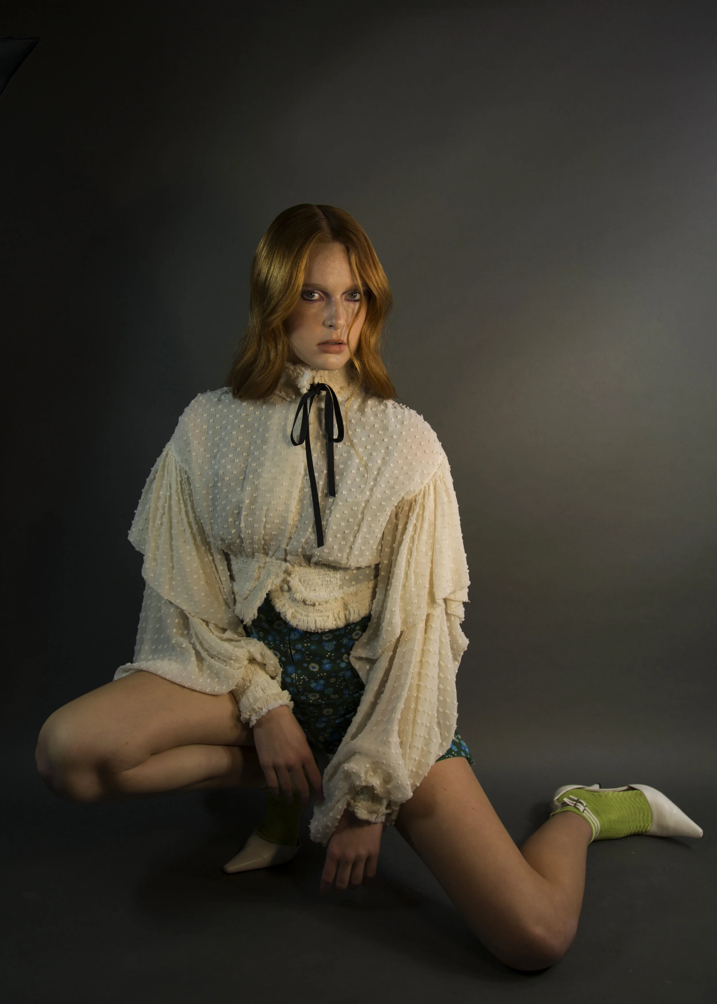 Photographer: Ryan Barhaug Model: Olivia Lund @Select Model Global Fashion Designer: Veronica Sheaffer Wardrobe Credits: White Top, Green Jumper - Pilsen Vintage Shoes and Socks are stylists own