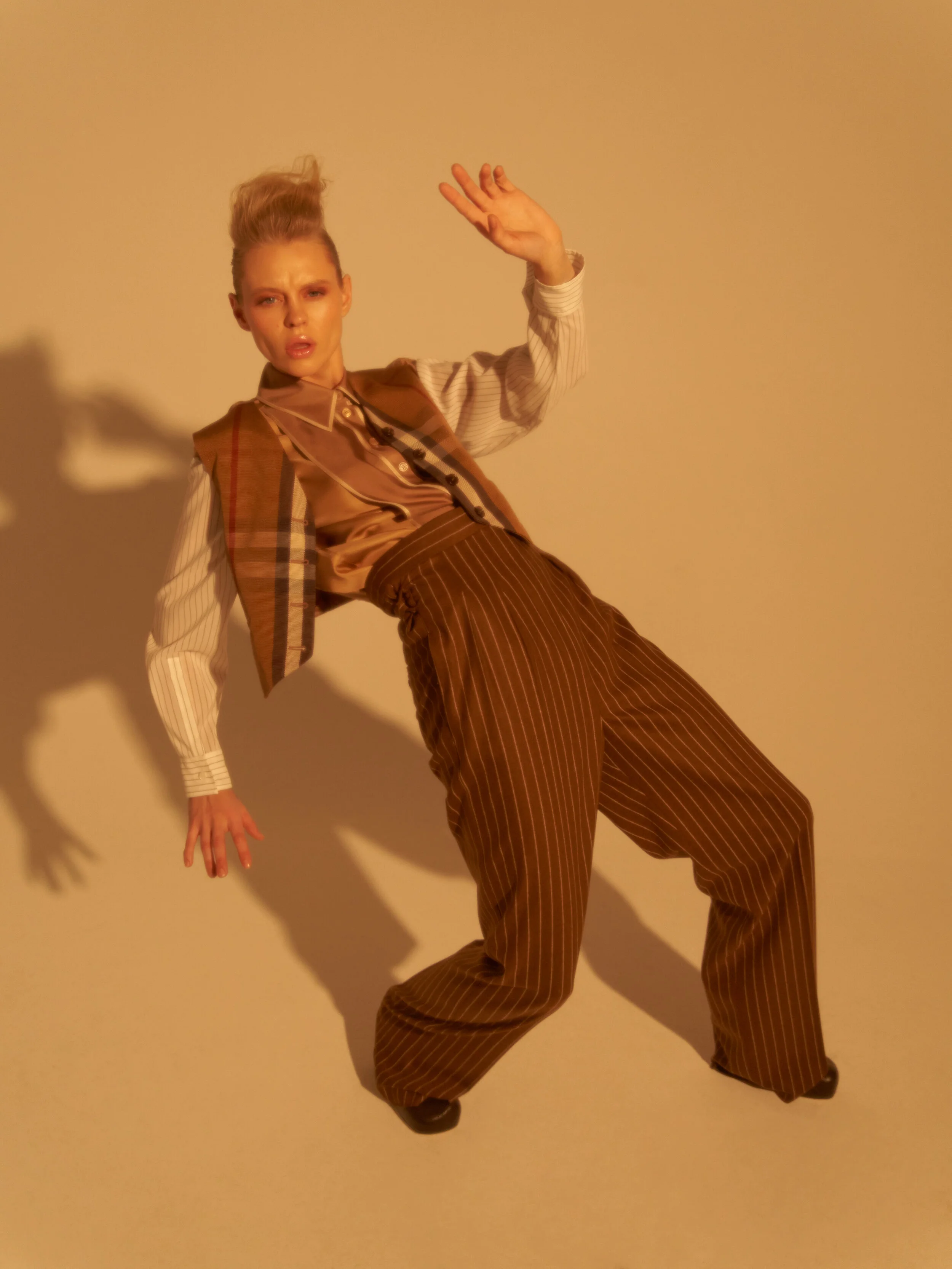 Photographer: Tomjuskevicius Female Model: Laura Aleks Makeup Artist: Rusne Gabriele Donaityte Hair Stylist: Anželika Wojc Stylist: Violeta Krasovska Wardrobe Credits: Burberry shirt Burberry vest Max Mara pants Bottega Veneta high