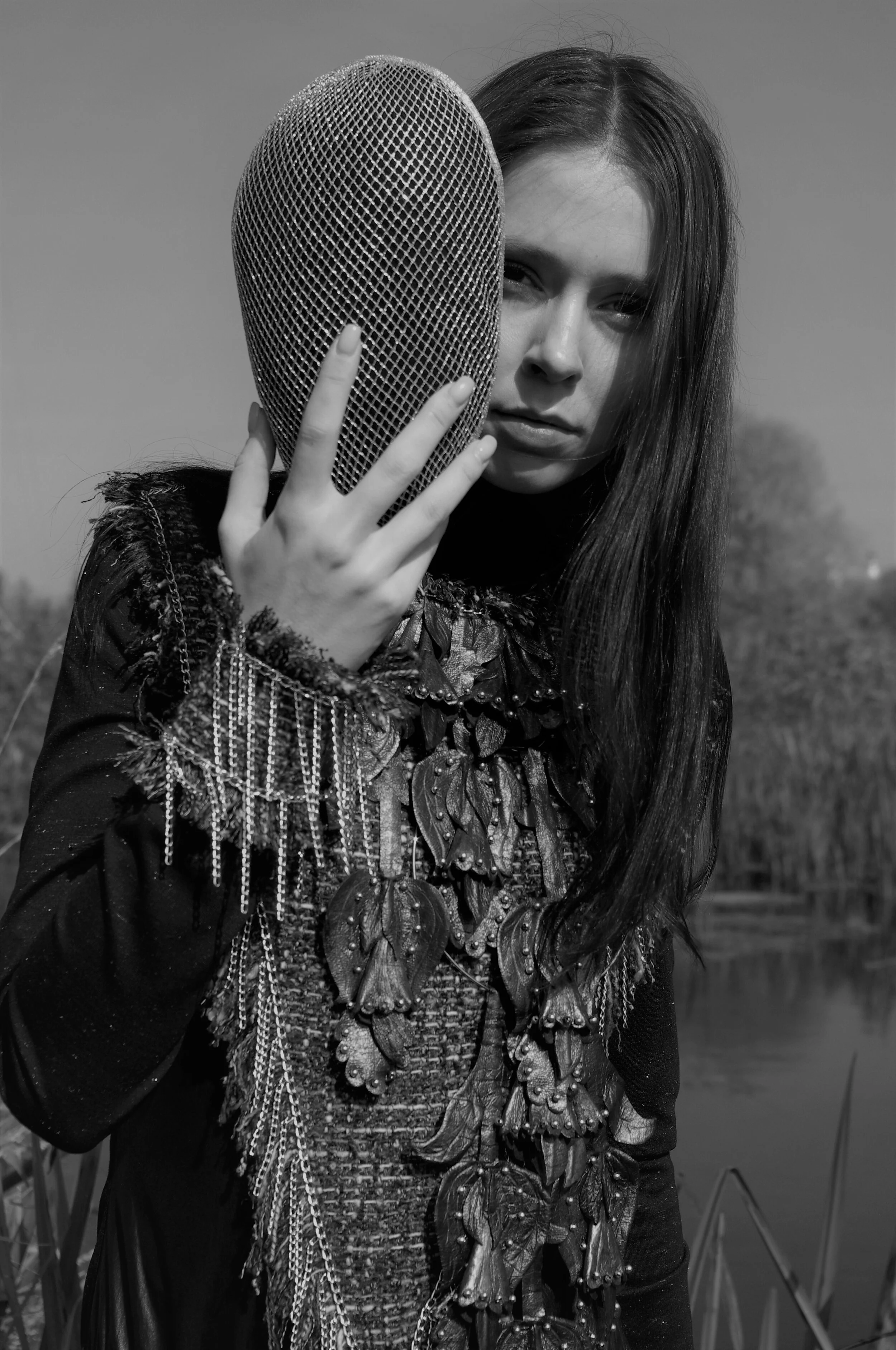 Photographer: Marina Uralskaya Fashion Designer: Marina Uralskaya Model: Valentina Gorbacheva Wardrobe Credits: Silver mask , leather necklace, tweed and jersy bodysuit by Marina Uralskaya