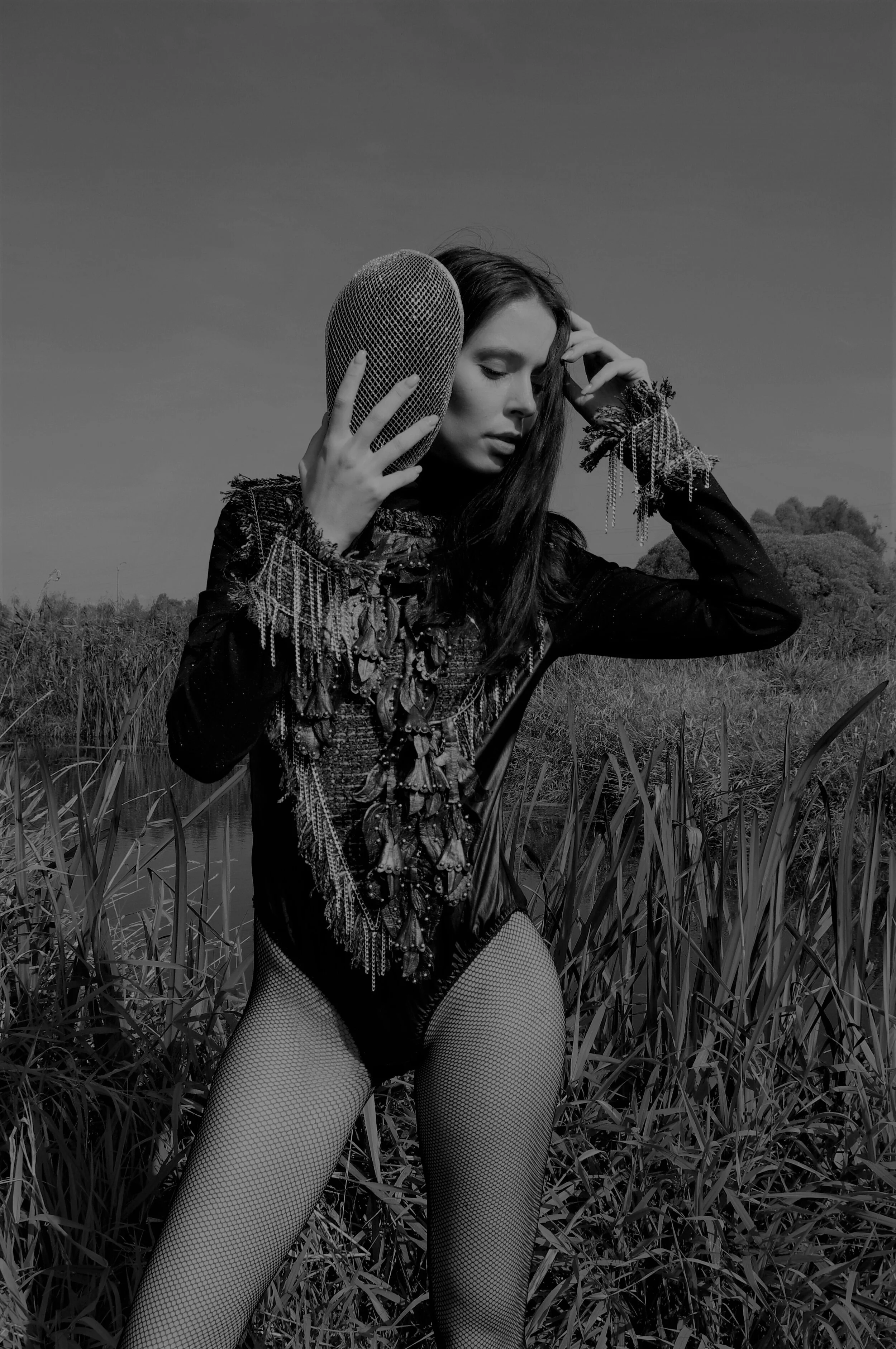Photographer: Marina Uralskaya Model: Valentina Gorbacheva Fashion Designer: Marina Uralskaya Wardrobe Credits: Leather necklace, silver mask, tweed and jersy bodysuit by Marina Uralskaya