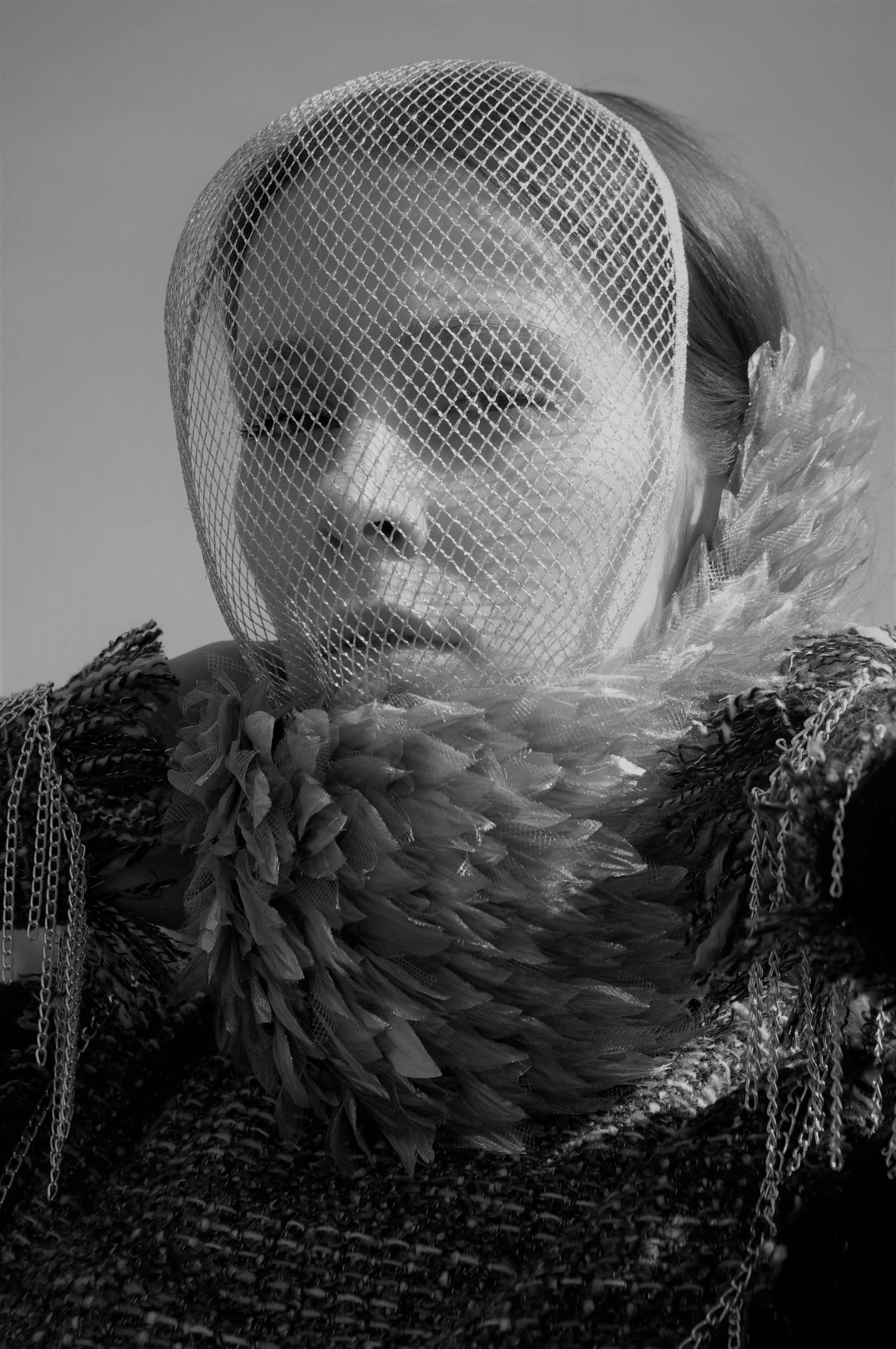 Photographer: Marina Uralskaya Model: Valentina Gorbacheva Fashion Designer: Marina Uralskaya Wardrobe Credits: Silver mask, organza and tuiie collar, tweed and and jersy bodysuit by Marina Uralskaya