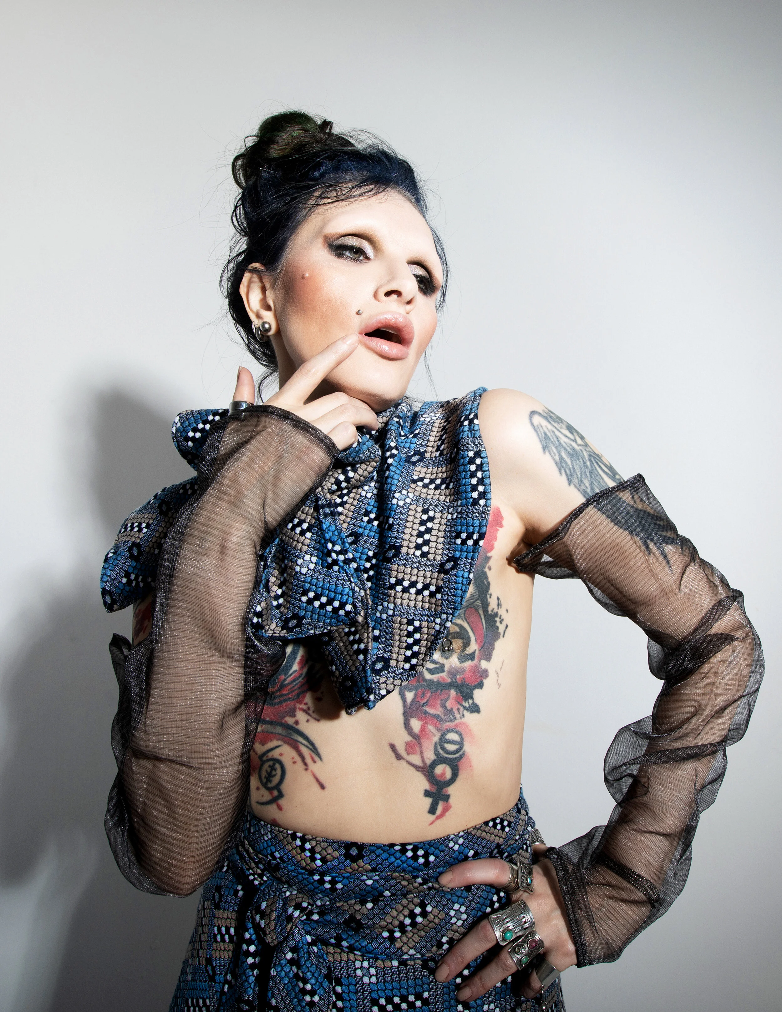 Photographer: Raisa Kanareva Fashion Designer, Slylist, Make-up and hair artist, Androgynous model: Alex No Wardrobe Credits: Skirt, pelerine, gloves - A.No design Jacket – Chanel Shoes- t.u.k. Tights – Adrian (for men); Original ethni