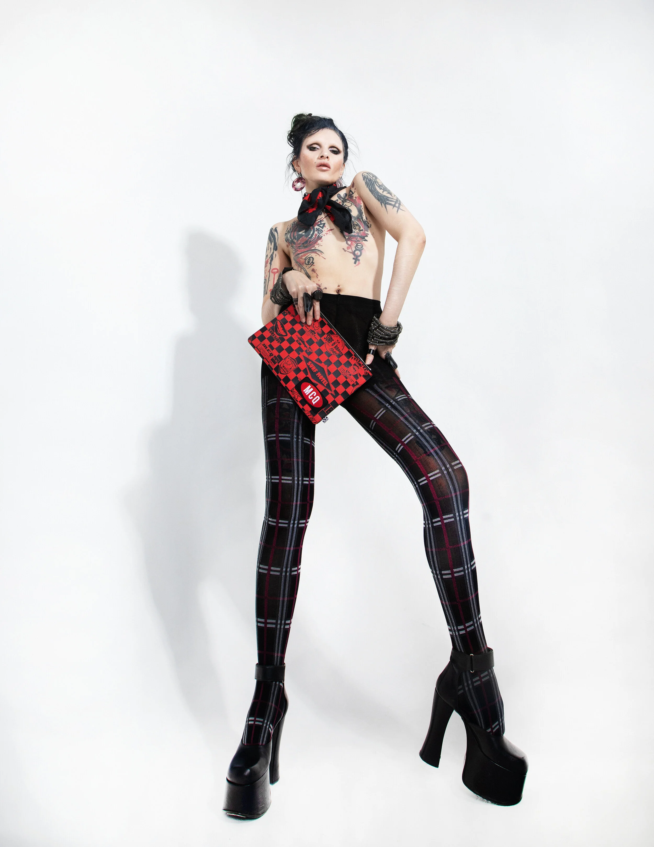 Photographer: Raisa Kanareva Fashion Designer, Slylist, Make-up and haire artist, Androgynous model: Alex No Wardrobe Credits: Shoes – Robbi & Andre Clutch, headband (neck) – Alexander McQueen Tights – Omero; Vintage earrings rings