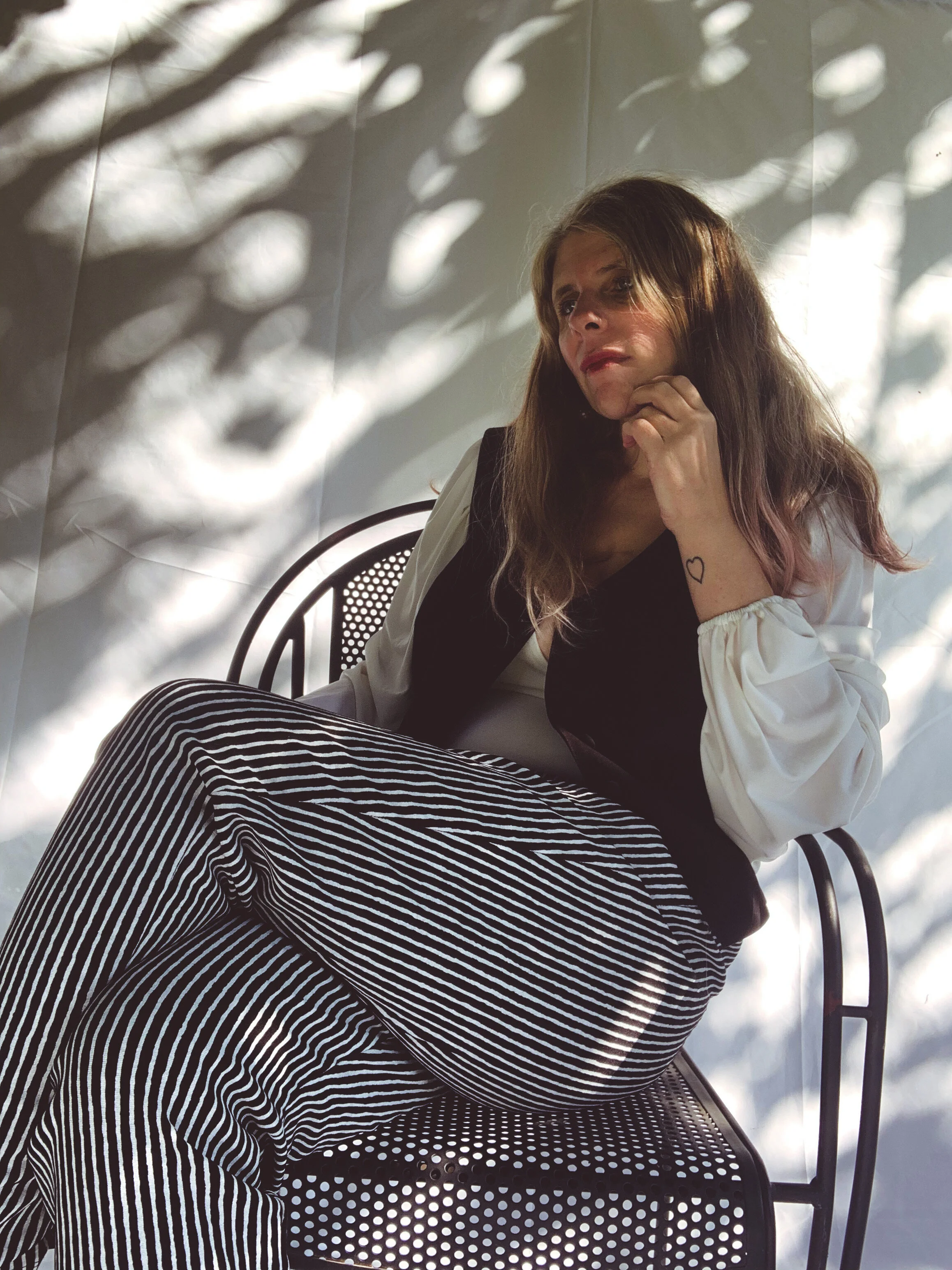 Female Model/Photographer/Creative Director: Kristian Comer Producer: James Comer Wardrobe Credits: Top: La Femme en Noir Vest: La Femme en Noir Pants: La Femme en Noir