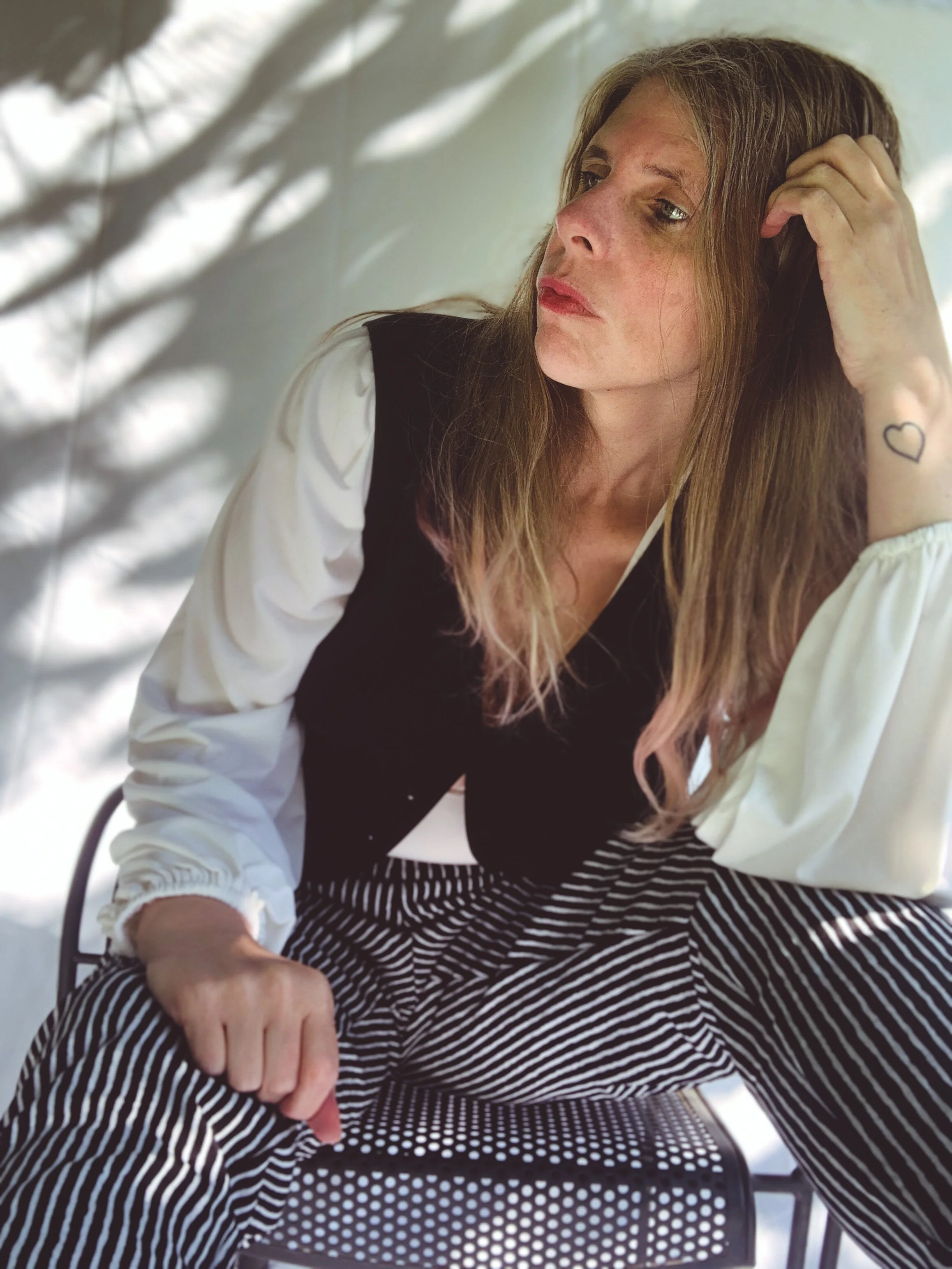 Female Model/Photographer/Creative Director: Kristian Comer Producer: James Comer Wardrobe Credits: Top: La Femme en Noir Vest: La Femme en Noir Pants: La Femme en Noir