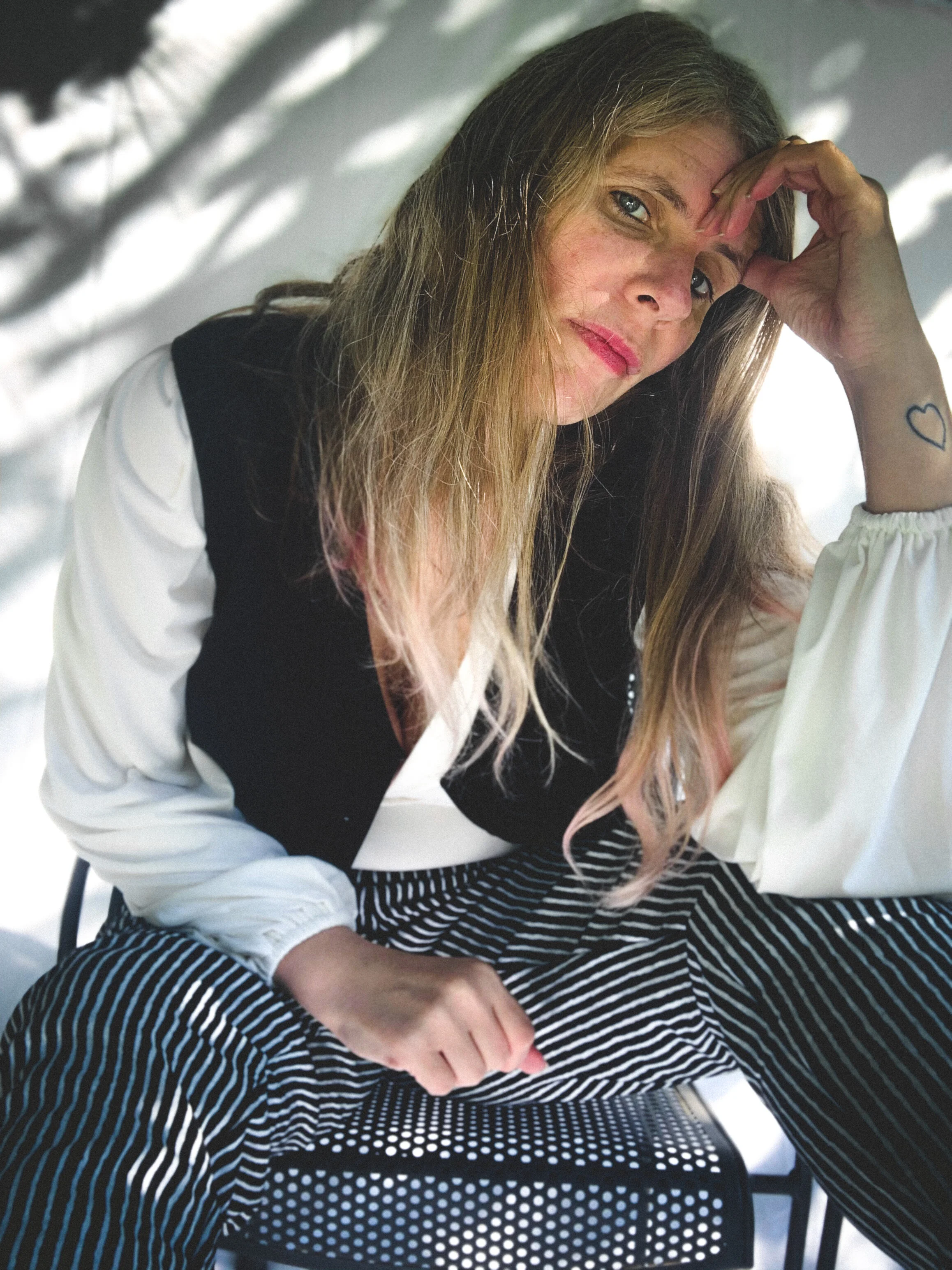Female Model/Photographer/Creative Director: Kristian Comer Producer: James Comer Wardrobe Credits: Top: La Femme en Noir Vest: La Femme en Noir Pants: La Femme en Noir