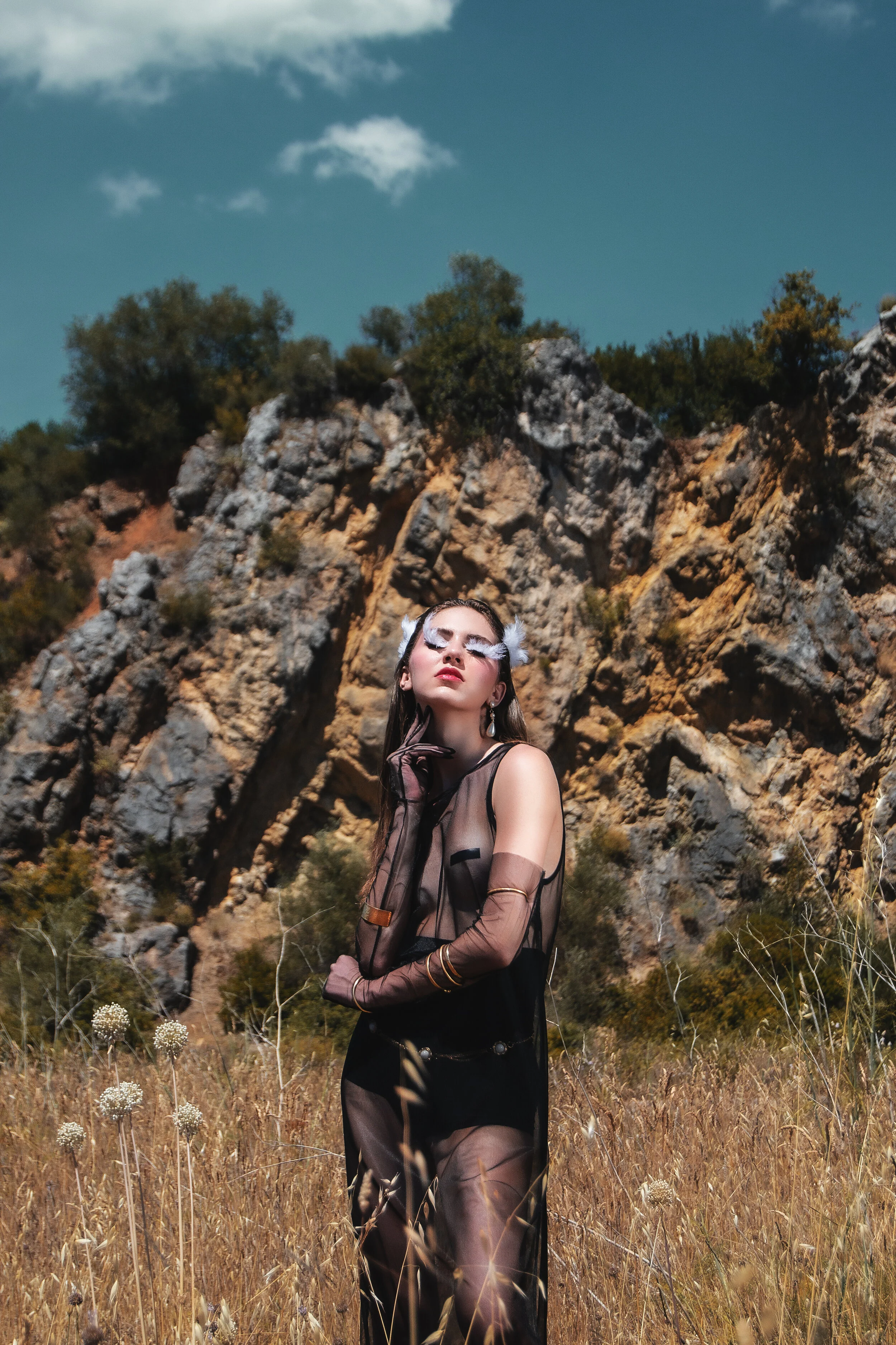 Photographer: Kamila Gjoka Model: Olivia Falciani @Espirit Model Management Stylist: Leonardo Pomposi Wardrobe Stylist: Elvira Savarese Makeup Artist: Enrica Belloni Wardrobe Credits: Black seethrough tunic: 16r Gloves: 16r Red fur: